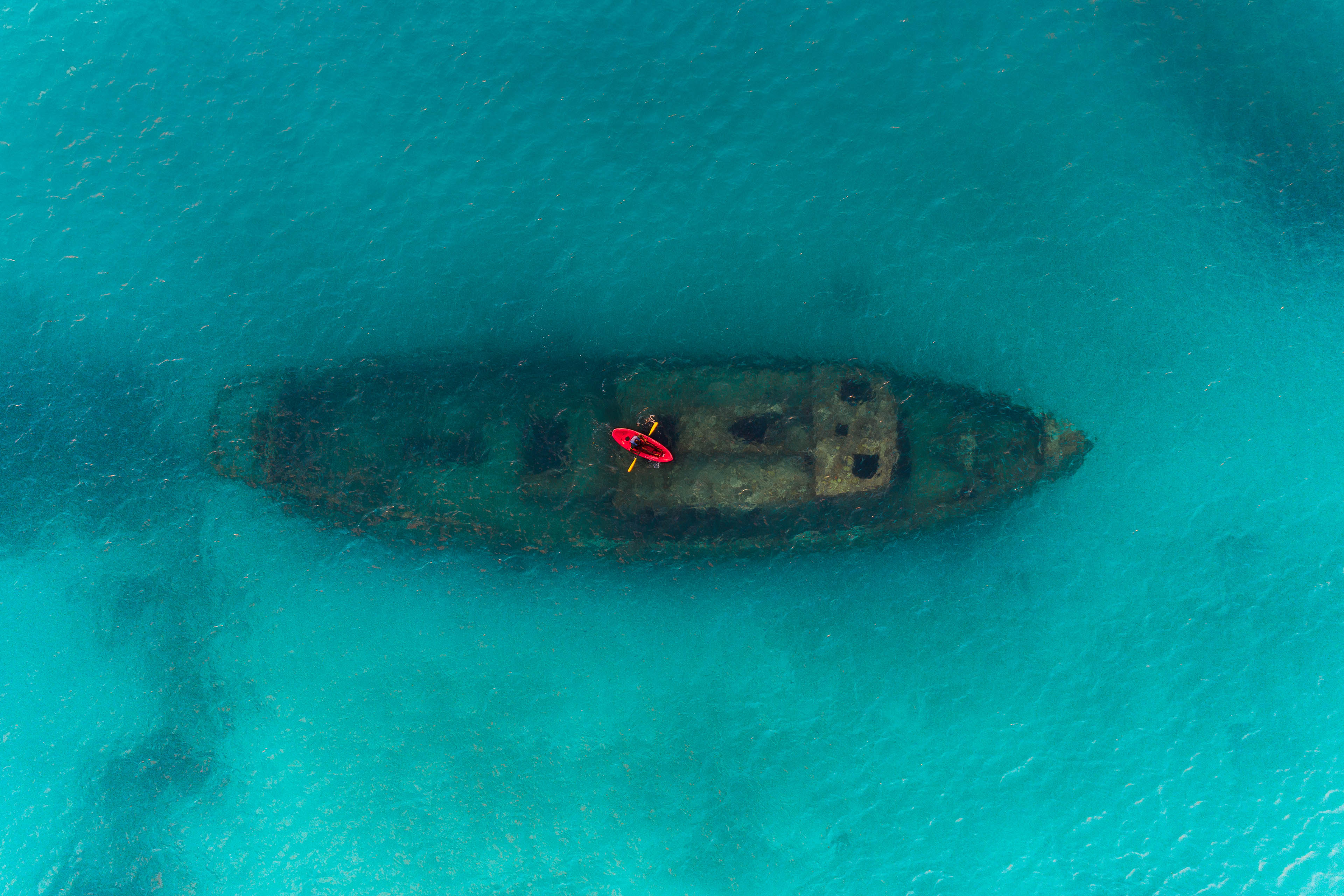 r921-ey-red-kayak-floating-above-a-shipwreck-carlisle-bay-barbados-background.jpg