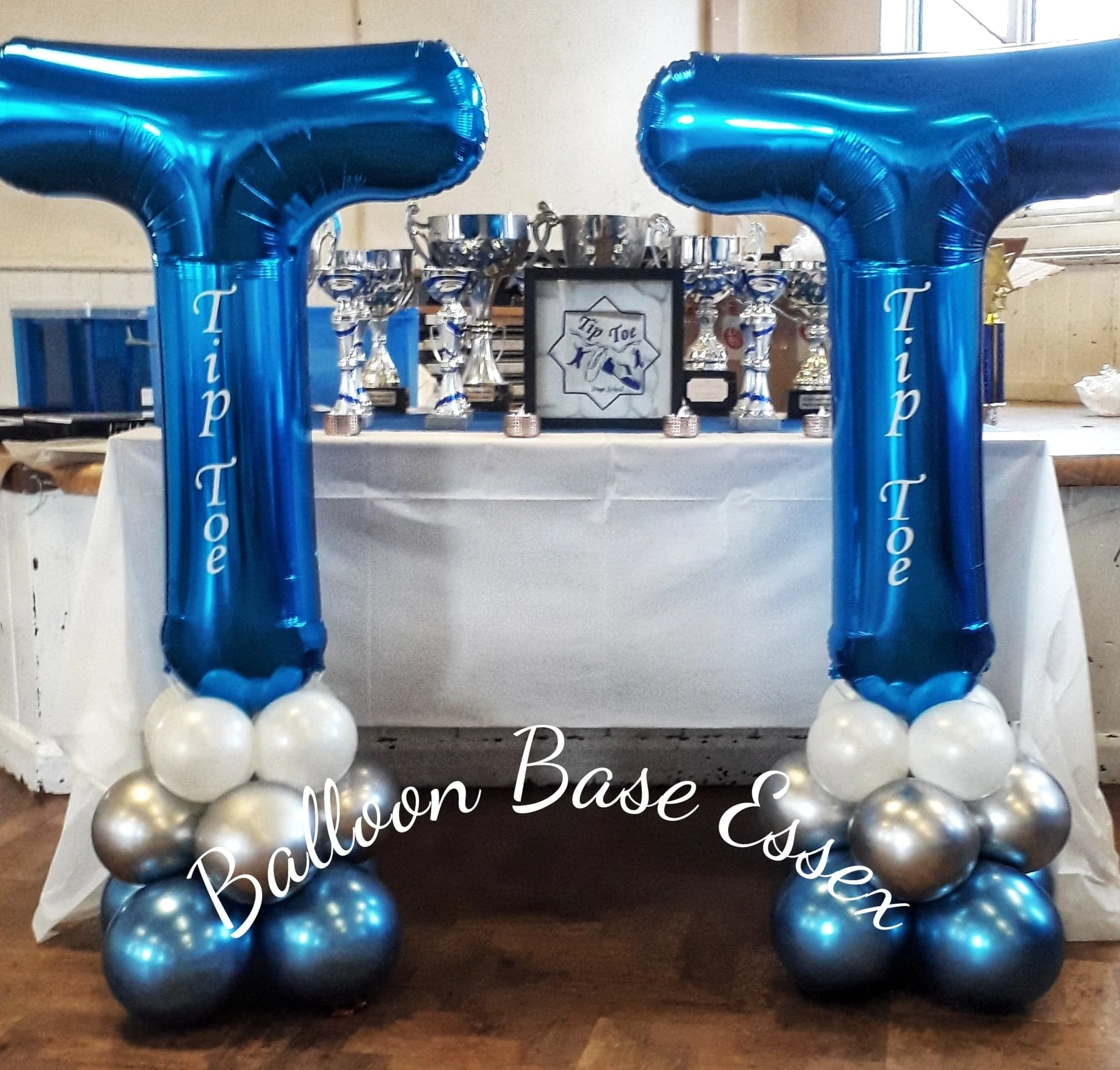 Large blue letter balloons for an awards ceremony