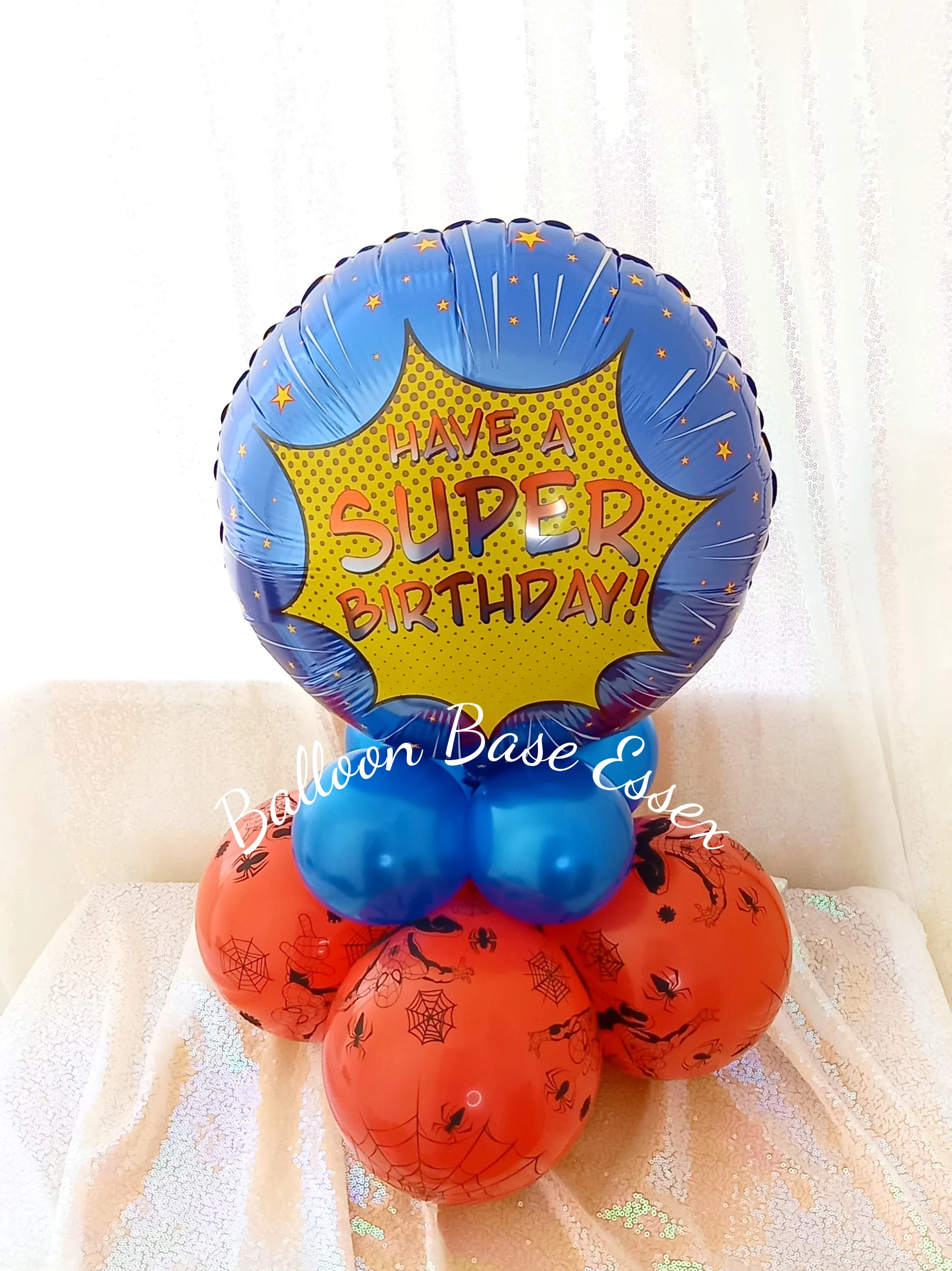 Superhero theme balloon centrepiece in blue and red
