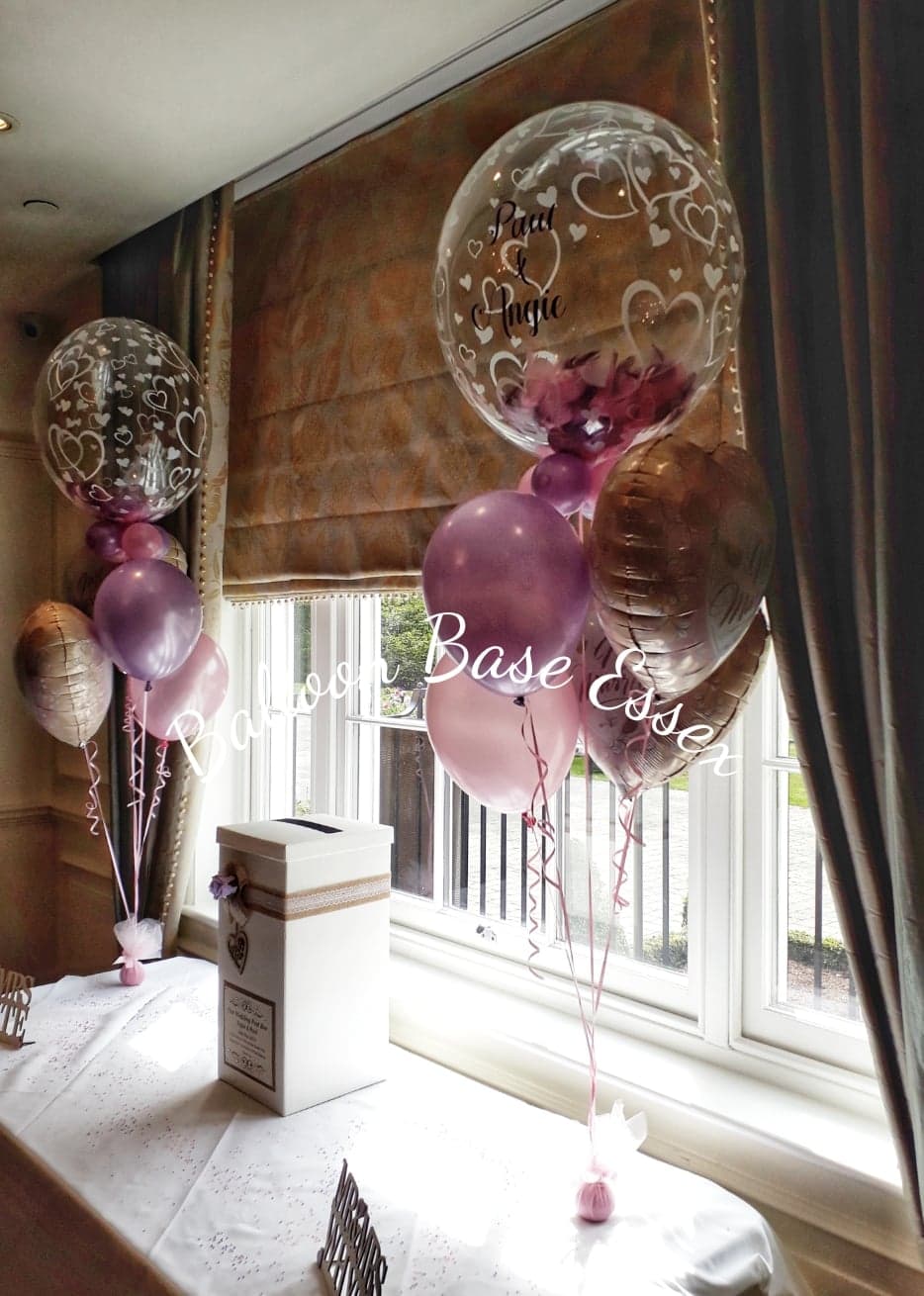 Pink and lilac wedding balloon bouquets