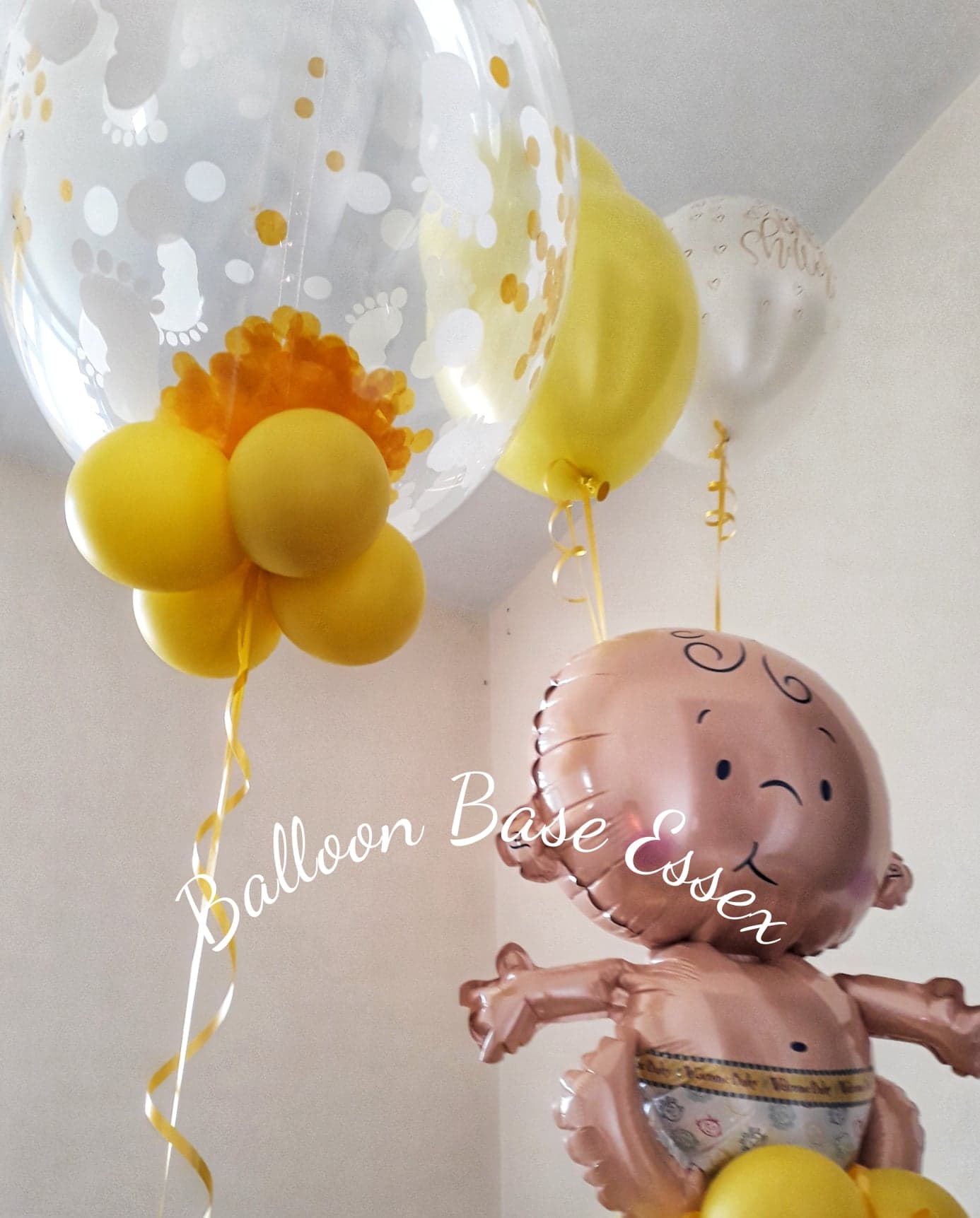 Yellow theme baby shower balloons with confetti bubble