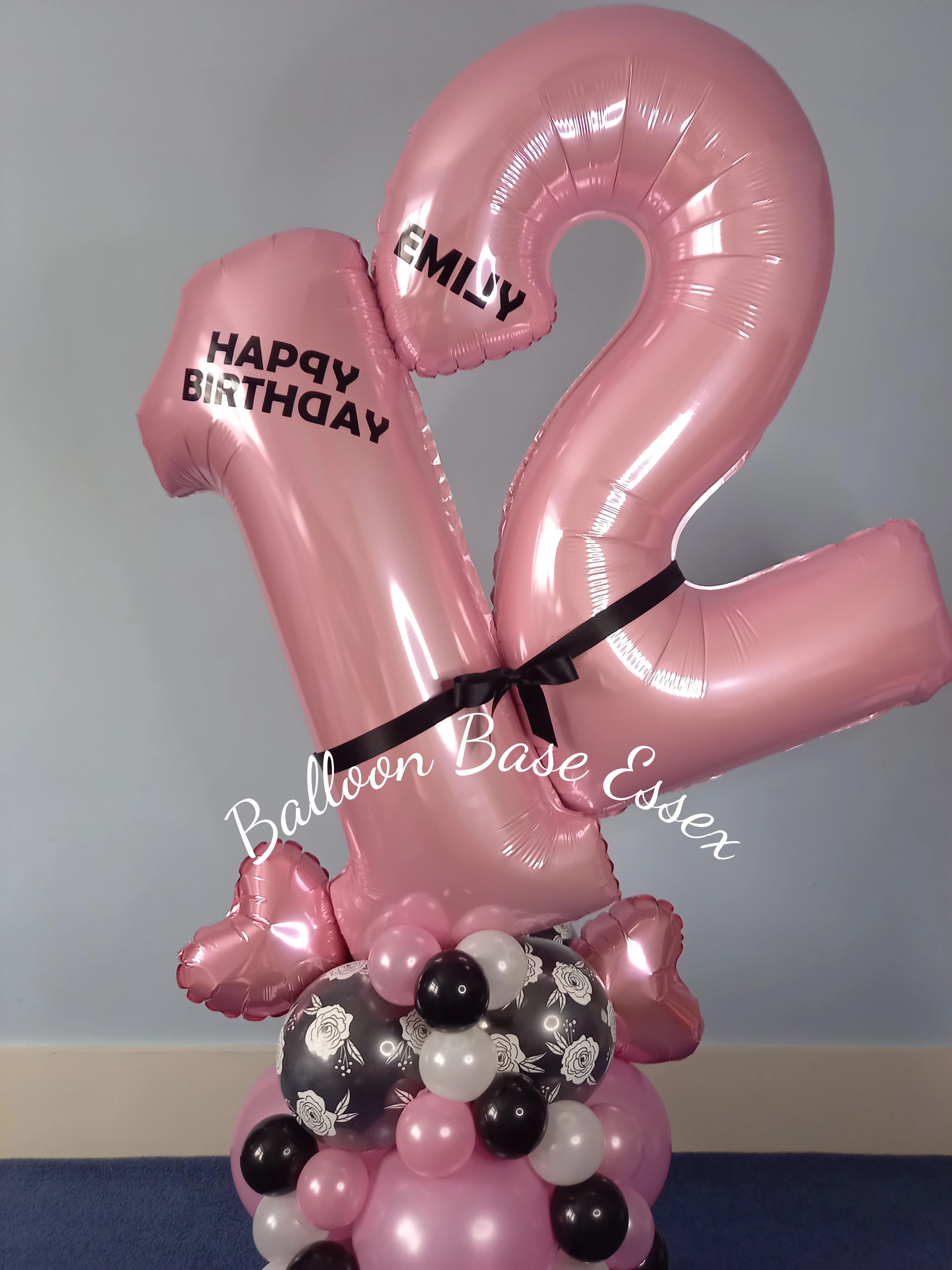 Personalised pink and black balloons for a 12th birthday
