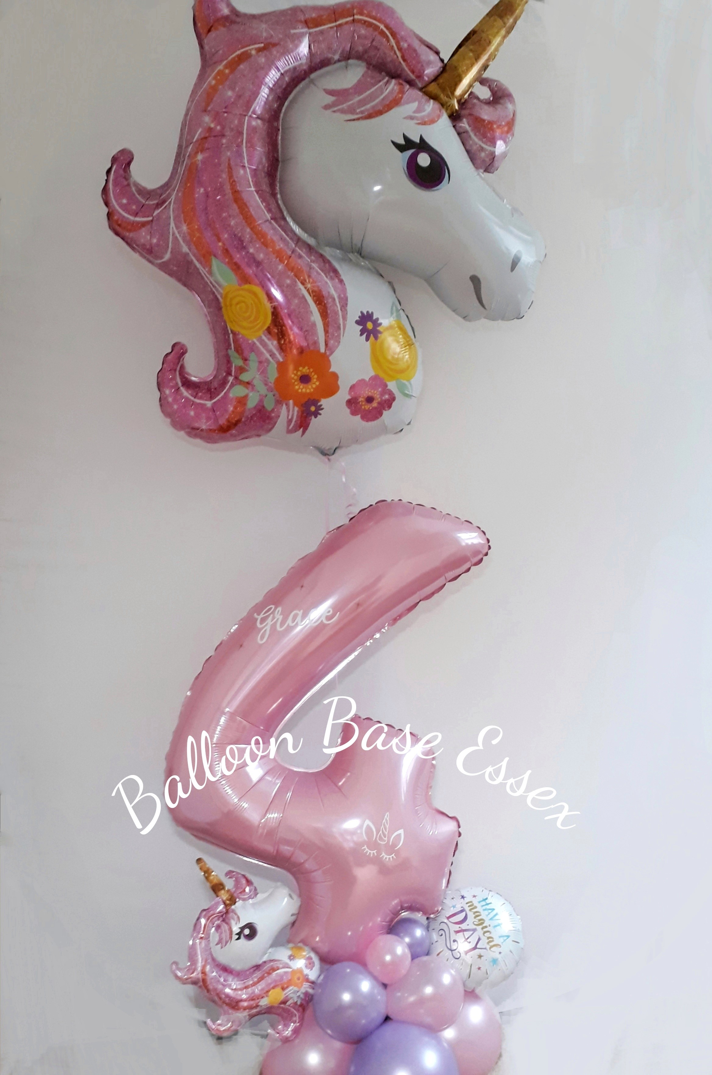Pink unicorn themed number 4 balloon
