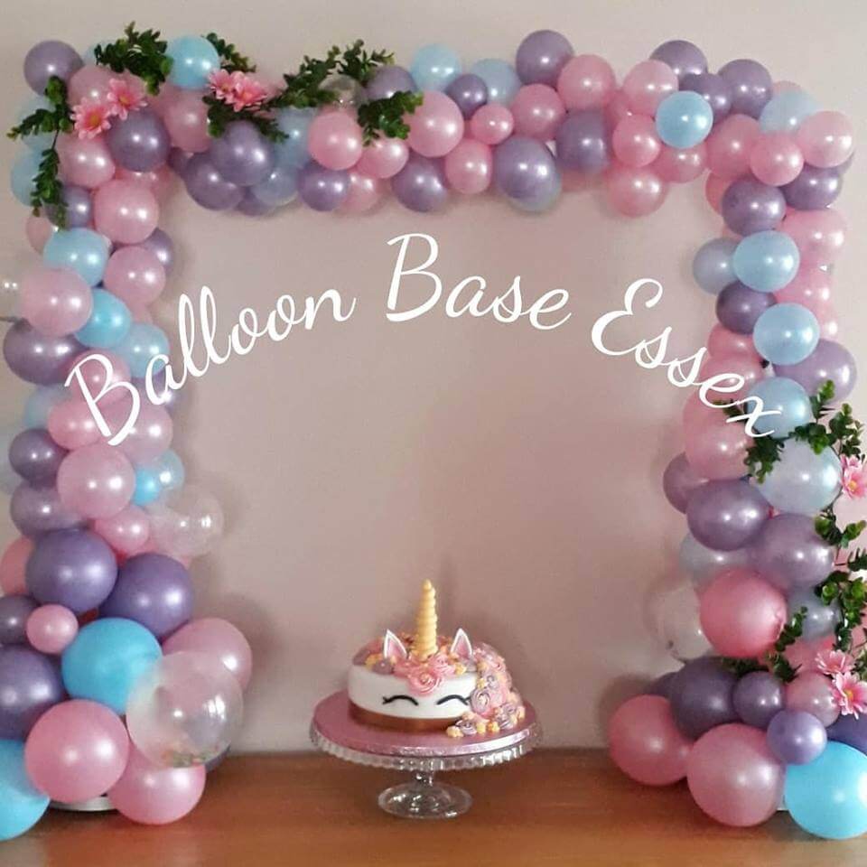 Balloon cake arch with foliage