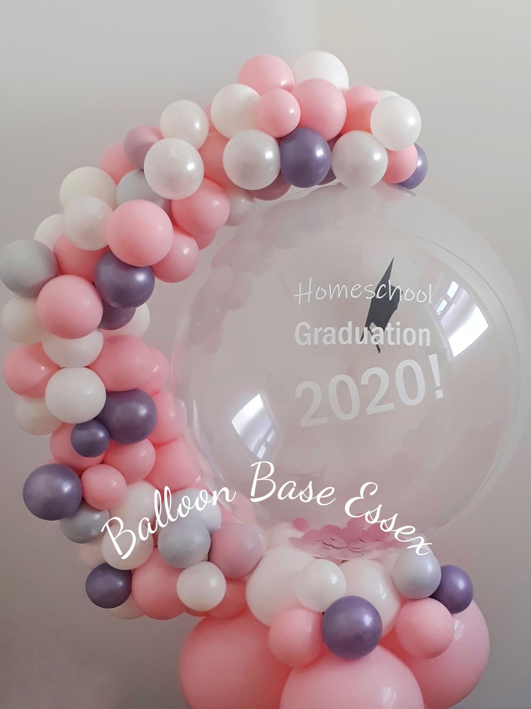 Clear balloon with a pastel garland to one side