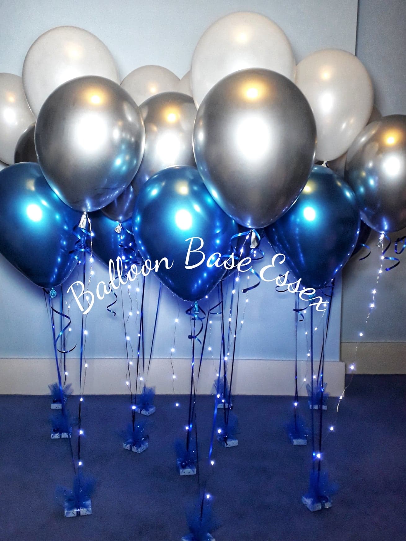Blue, silver and white balloon bouquets with lights