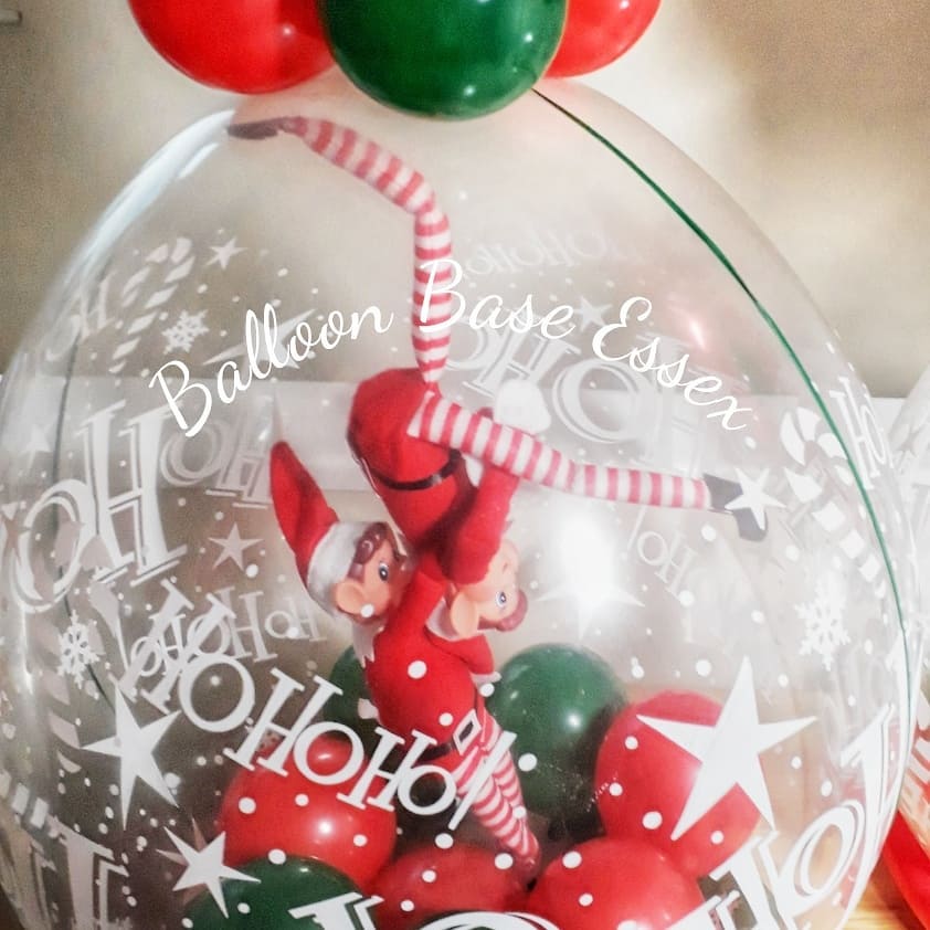 Christmas elves inside balloon
