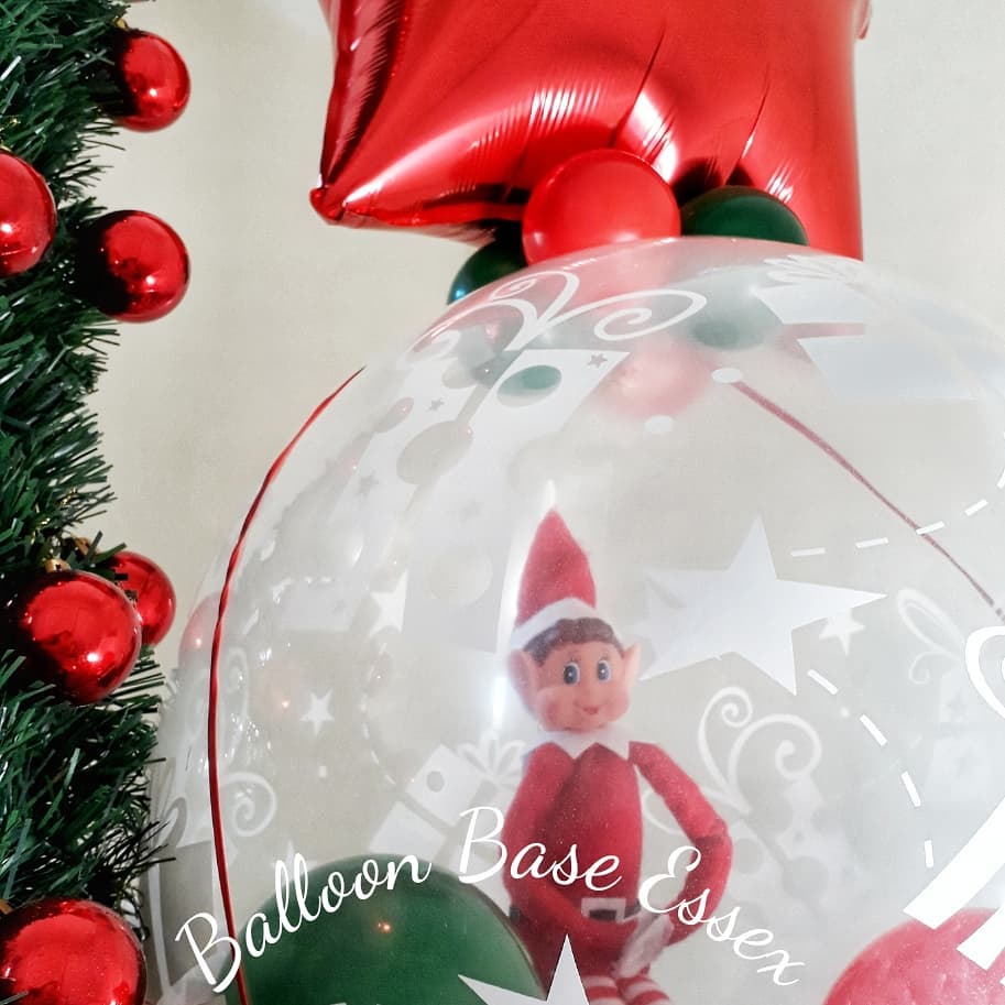 Christmas elf inside balloon