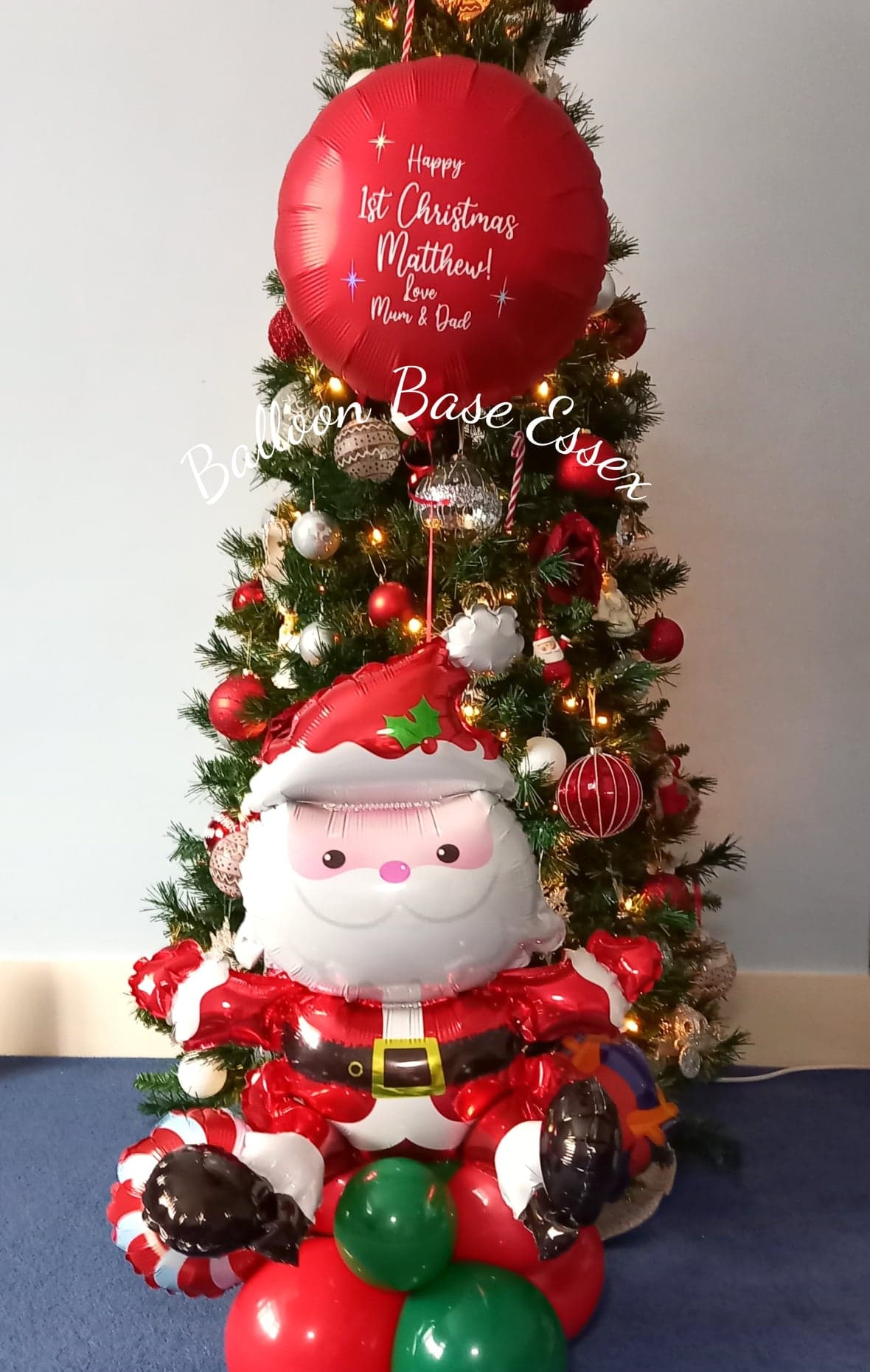 Christmas balloon with large Santa balloon at base