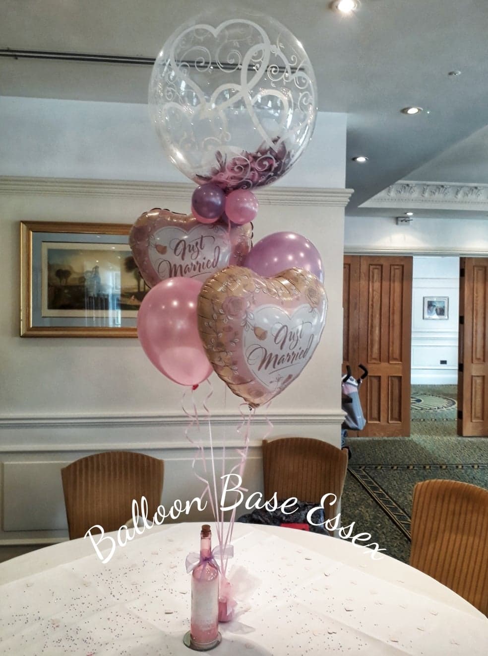 Wedding balloon bouquet with feather filled bubble balloon