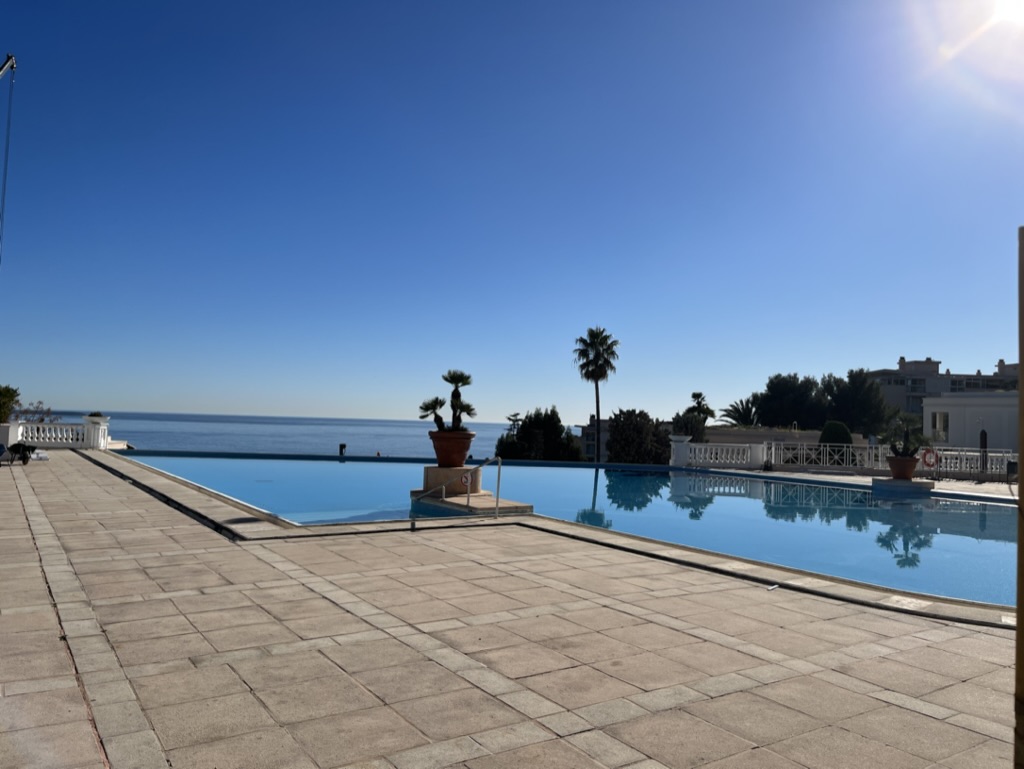 Infinity pool with view of the sea and islands