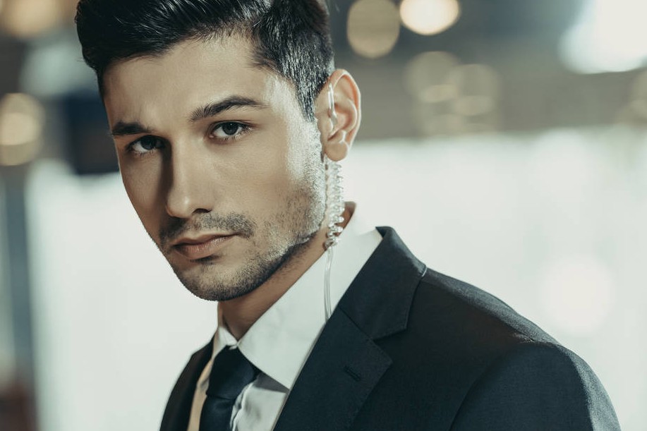 514291761146-stock-photo-handsome-security-guard-security-earpiece.jpg