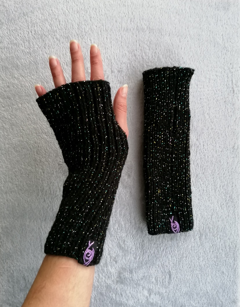 Sparkly black knitted gloves with a purple eye logo