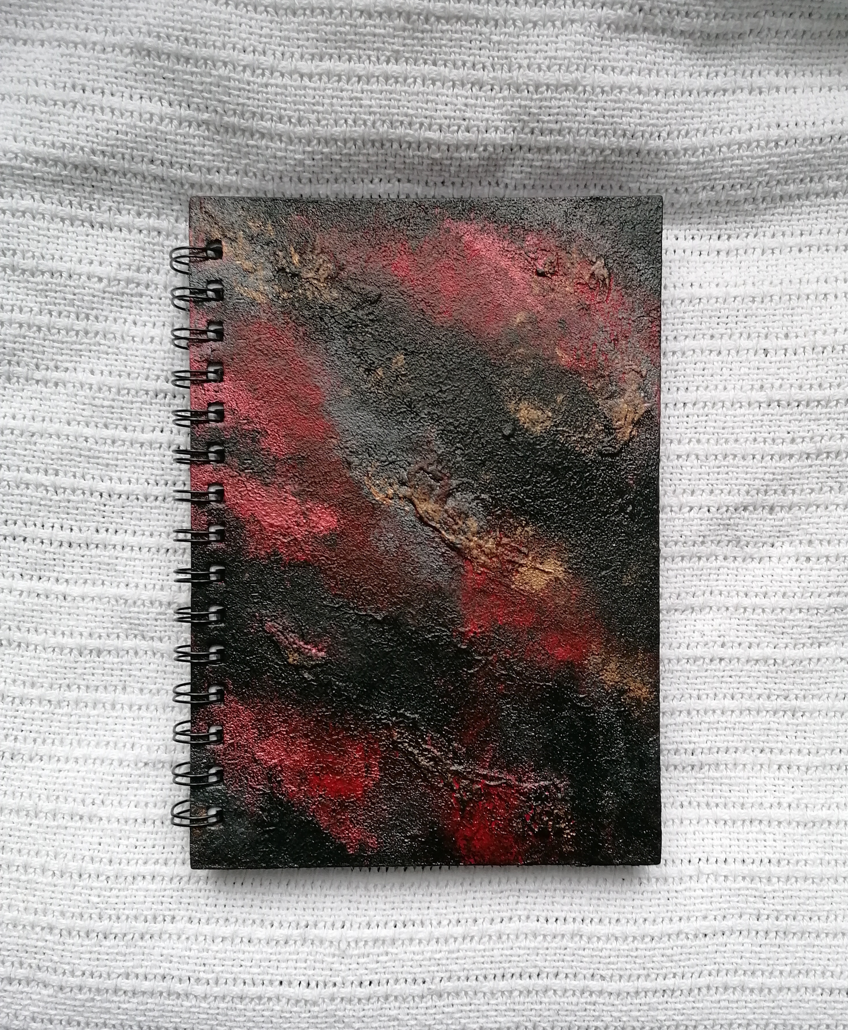 Black and red abstract painted notebook