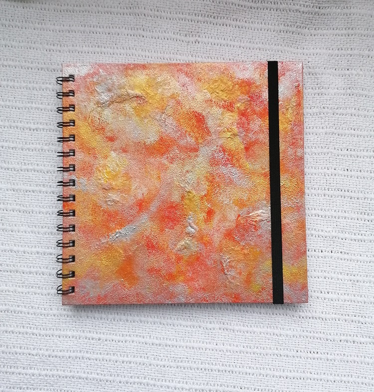 abstract painted sketchbook with orange and silver