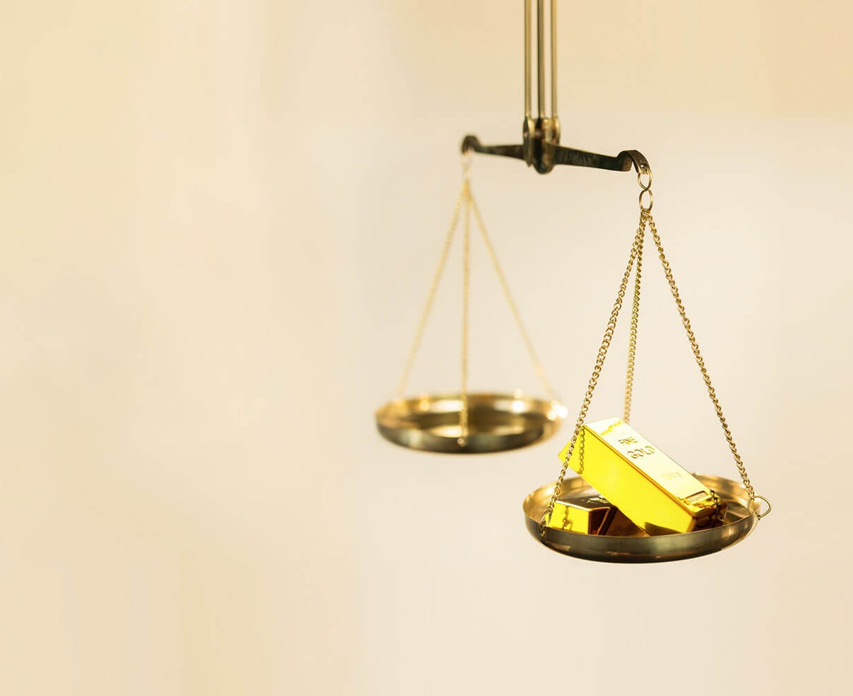 141012169936187-stock-photo-gold-on-the-scales-346843604-recovered-16213395175886.jpg