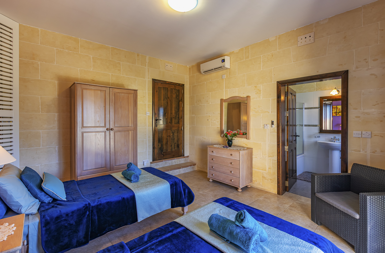 twin room with ensuite bathroom and terrace overlooking the pool and countryside views