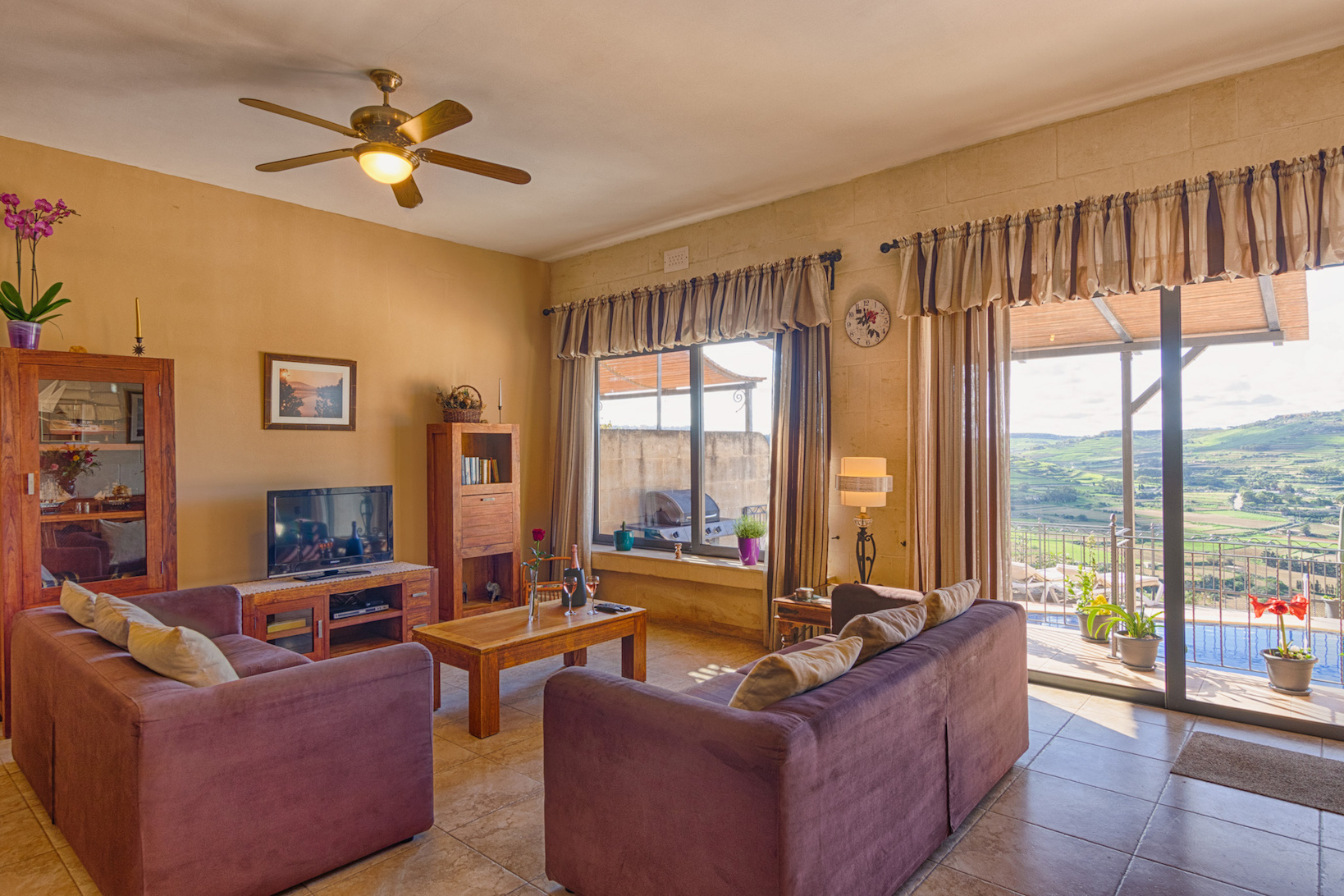 sitting area with pool and countryside views