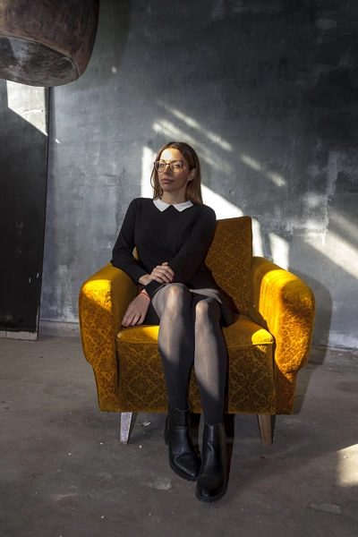 Yoana portrait in a yellow armchair