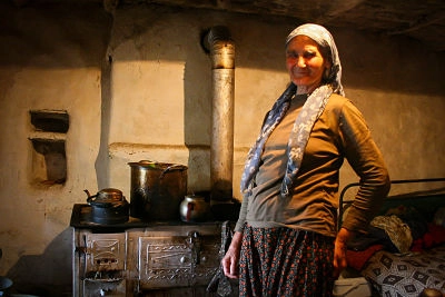 Old Bulgarian woman at her kitchen