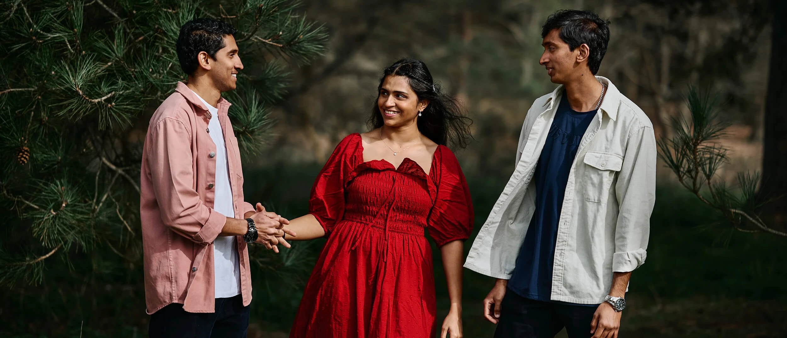 Family laughing together during outdoor photoshoot in Surrey