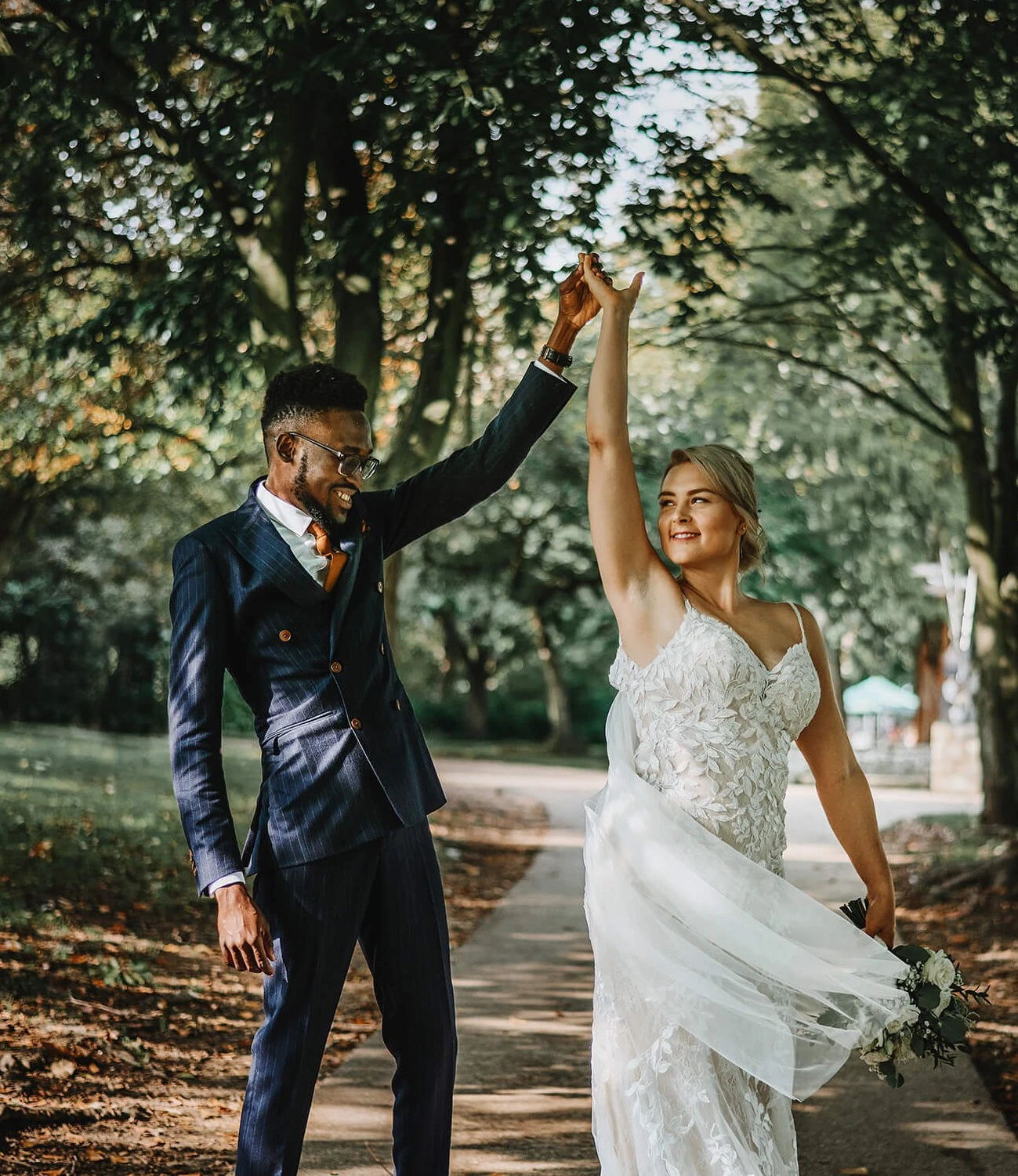 42277129915011737-weddingphotographerinbury-st-edmundssuffolkabbeygardensbiracialcouplece.jpg