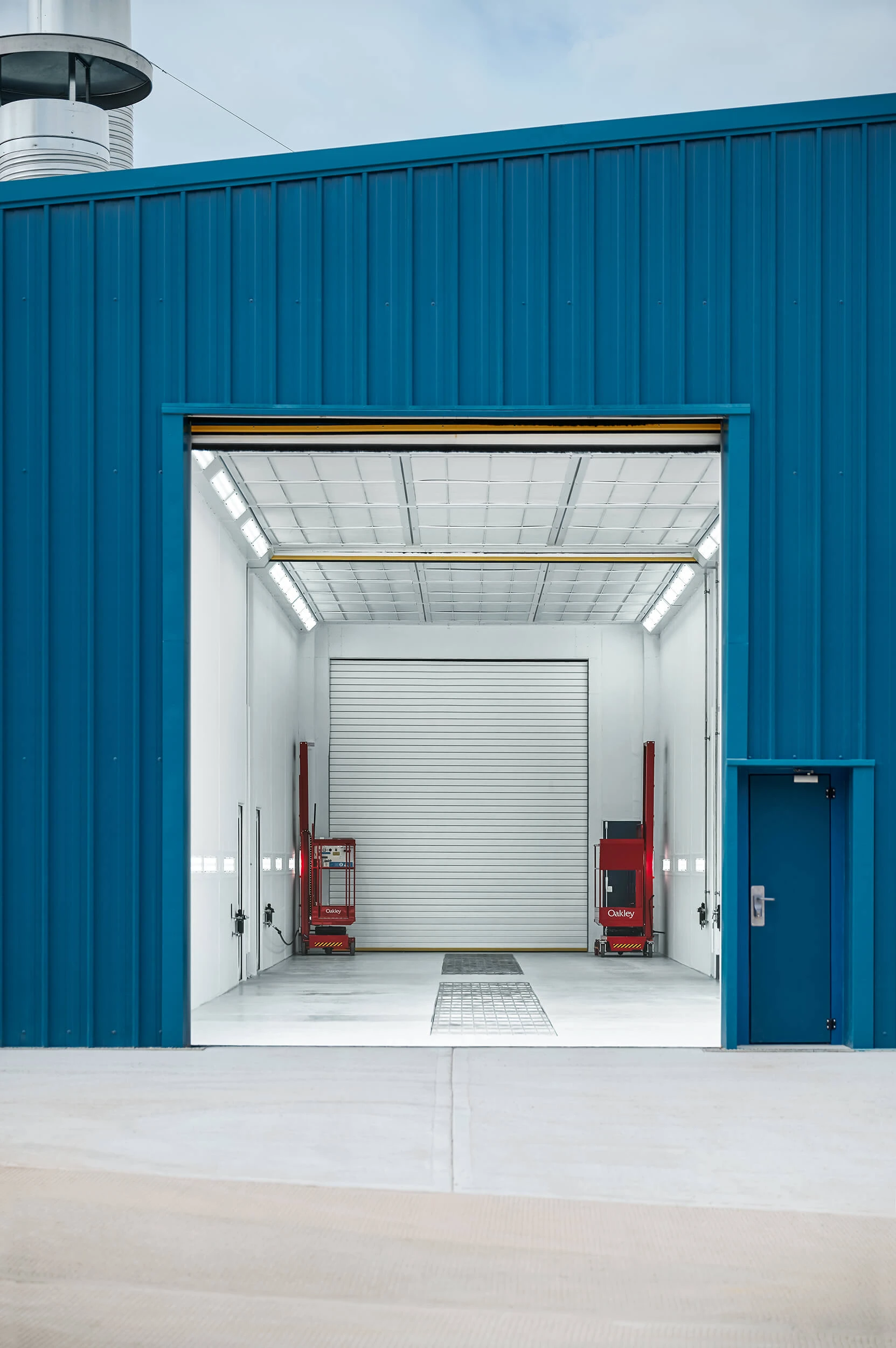 Interior of Junair industrial spray booth showing scale and airflow system