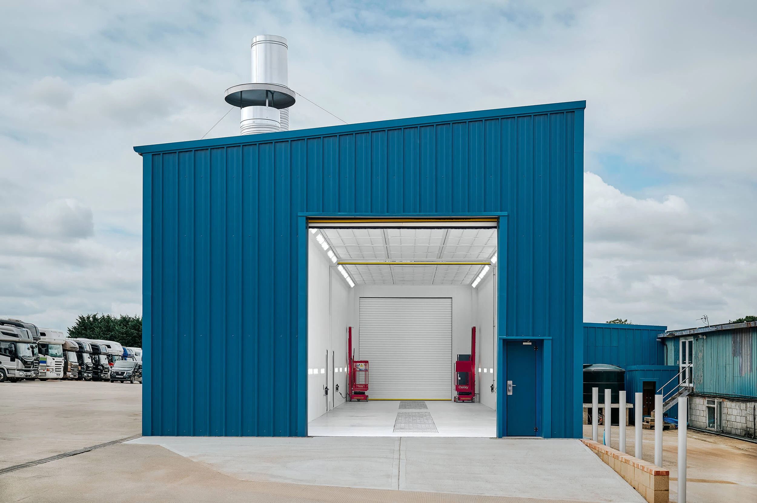 Wide exterior view of Junair commercial spray booth facility at client site