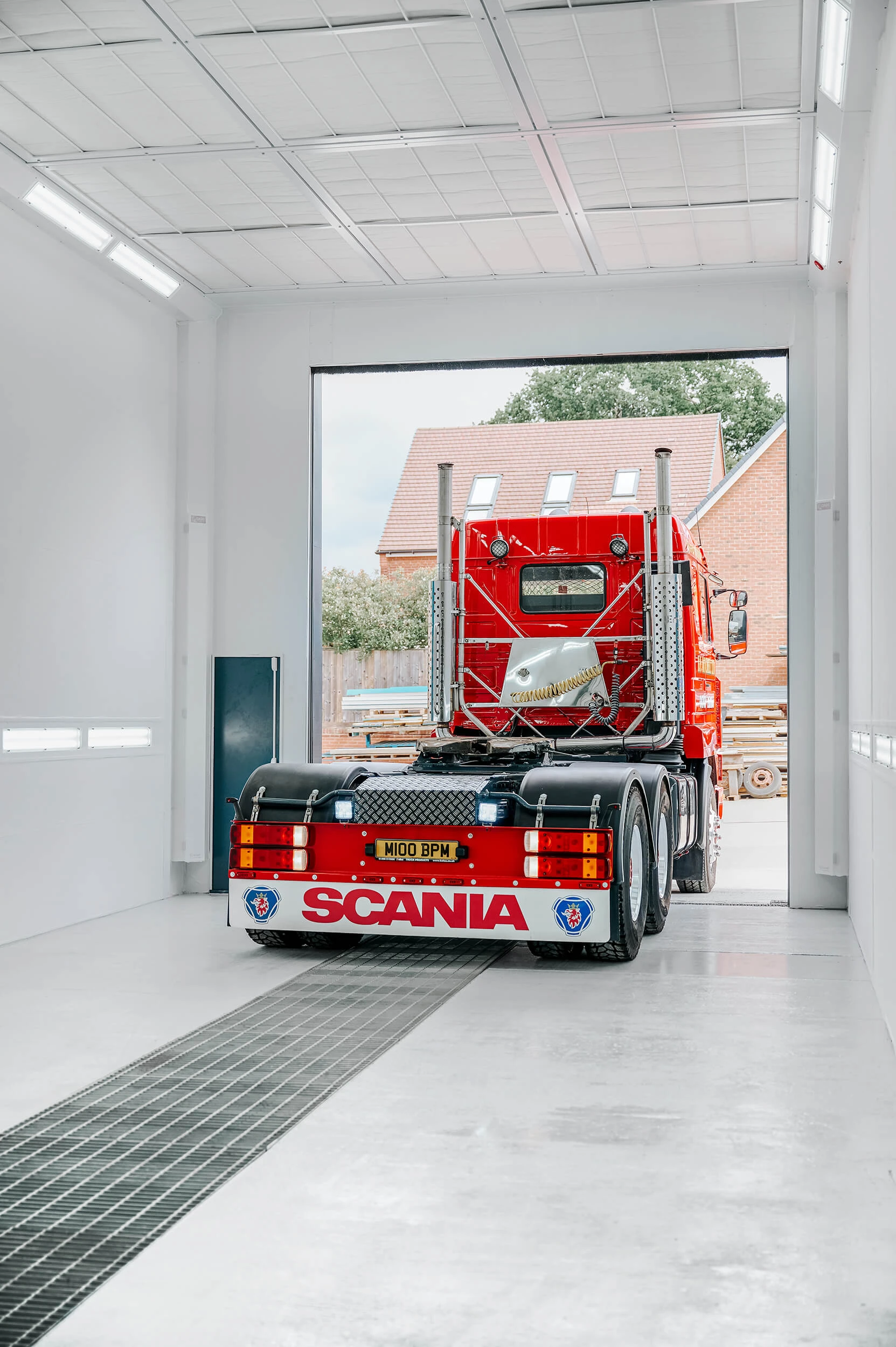 Industrial spray booth interior showing horsebox scale and workspace clearance