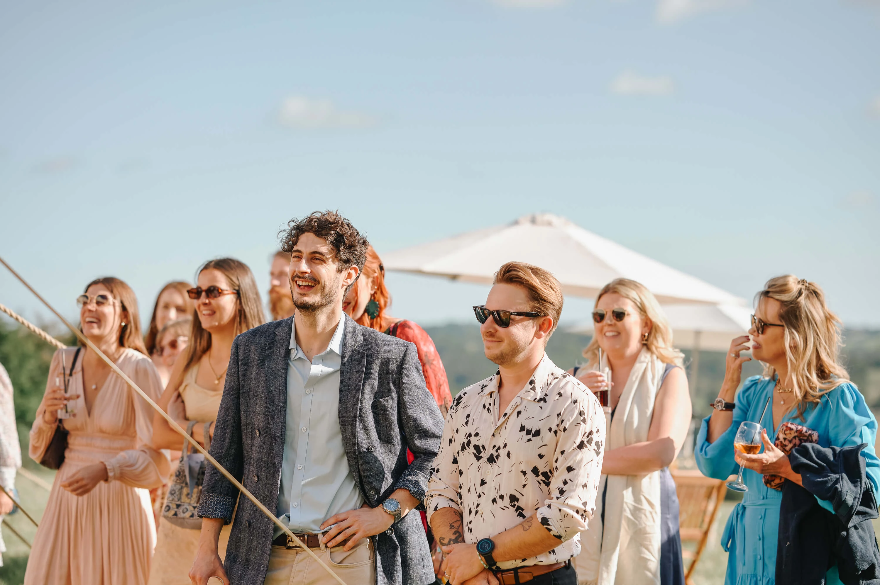 Wedding speeches at the vineyard reception with guests laughing in Canterbury