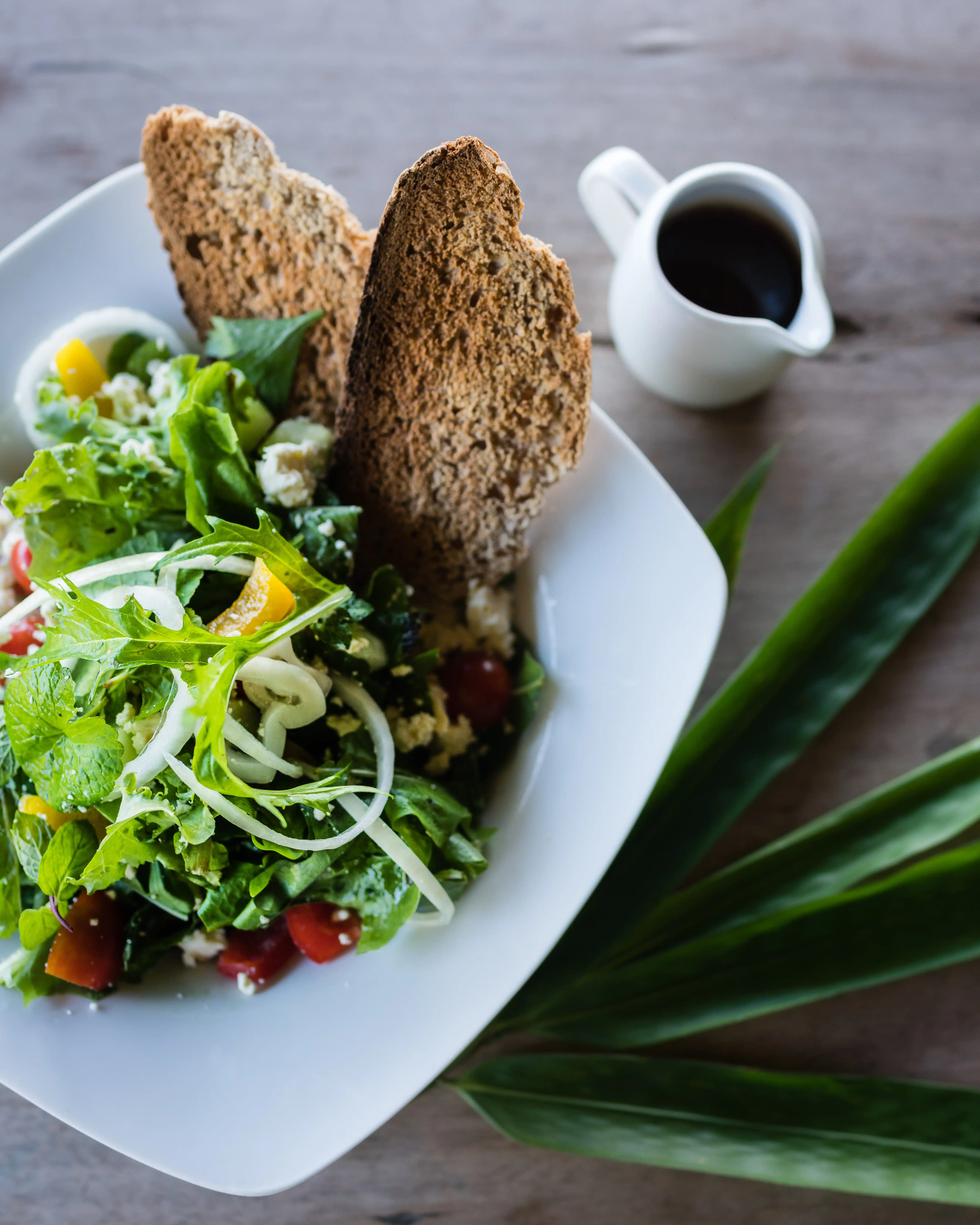Organic Salad with Fresh Greens at Bali Eco Stay Retreat Venue Organic salad with fresh greens, herbs, and bread at Bali Eco Stay retreat venue in Bali