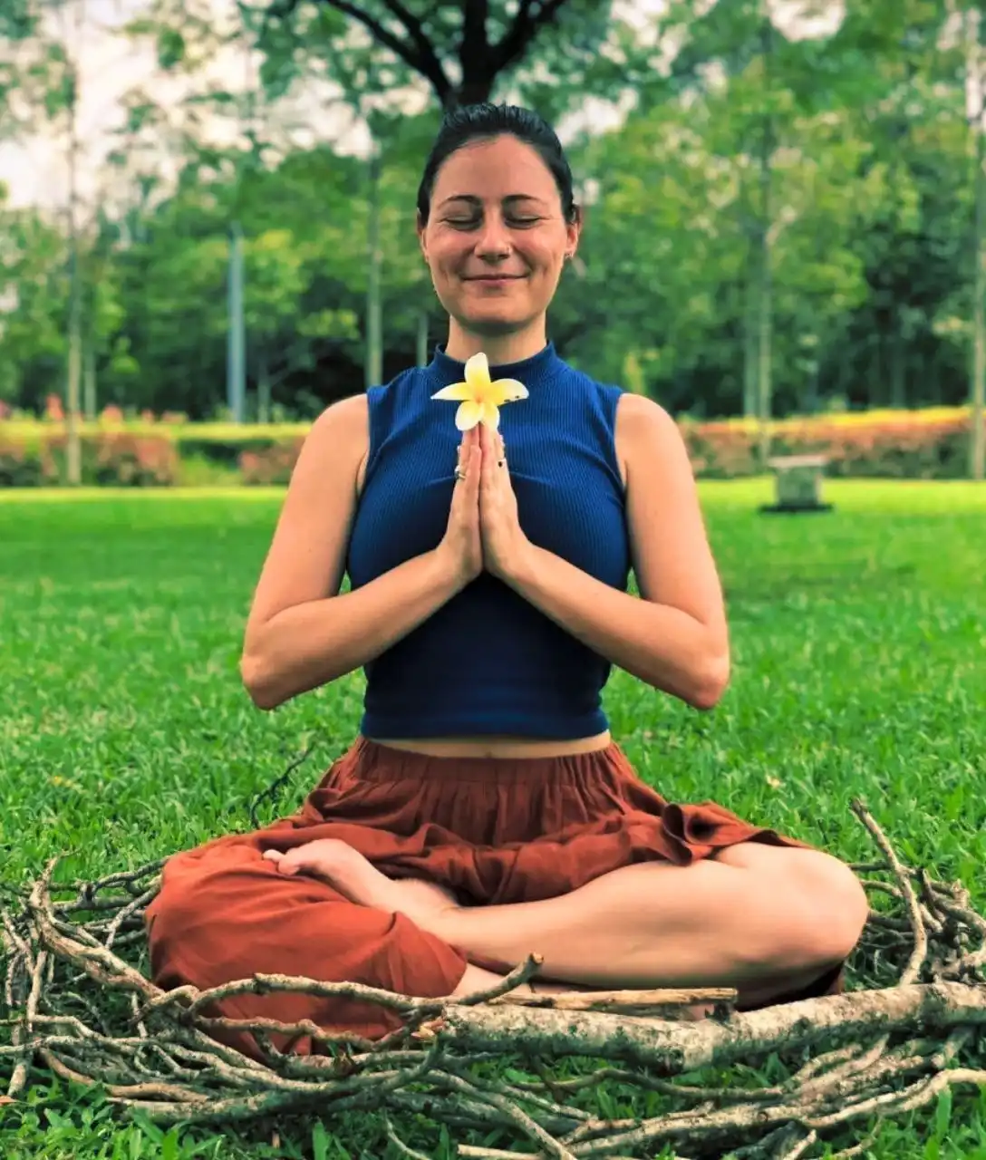 Carla meditating in the park 