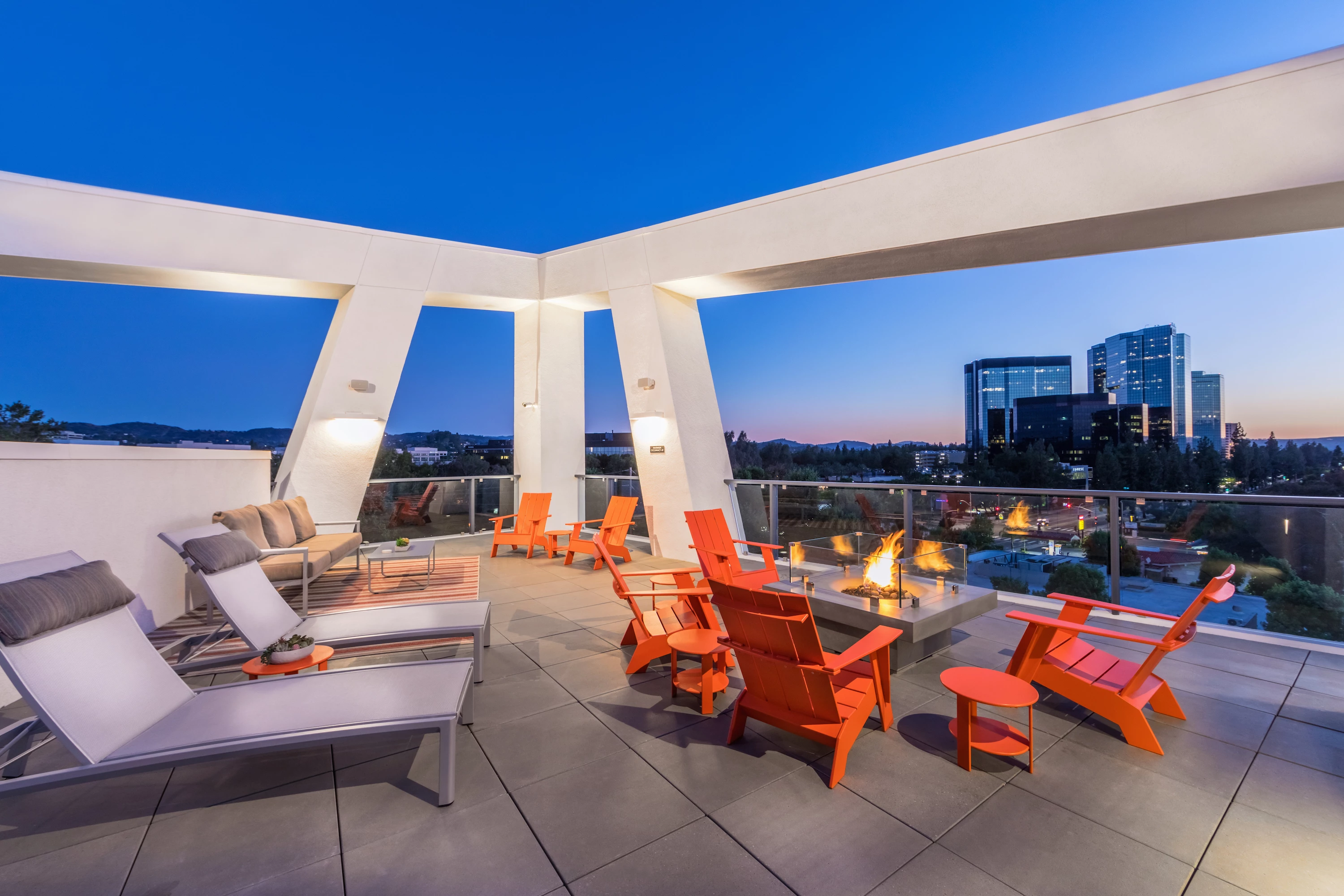 1241-10-amenity-tower-rooftop-lounge-fire-pit-night-at-vela-on-ox-apartments-in-woodl.jpg