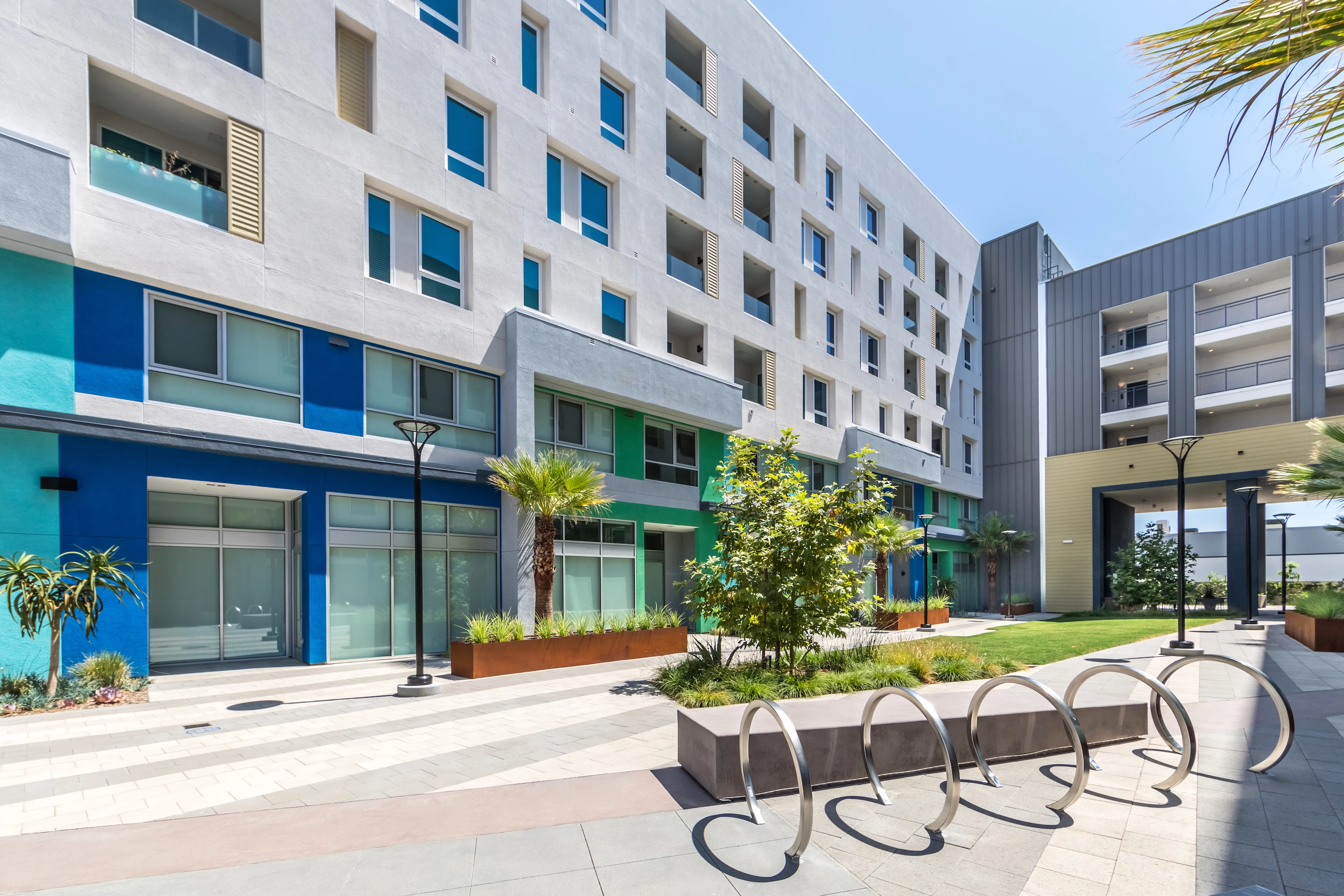 1251-17-exterior-front-courtyard-bike-racks-at-vela-on-ox-apartments-in-woodland-hill.jpg