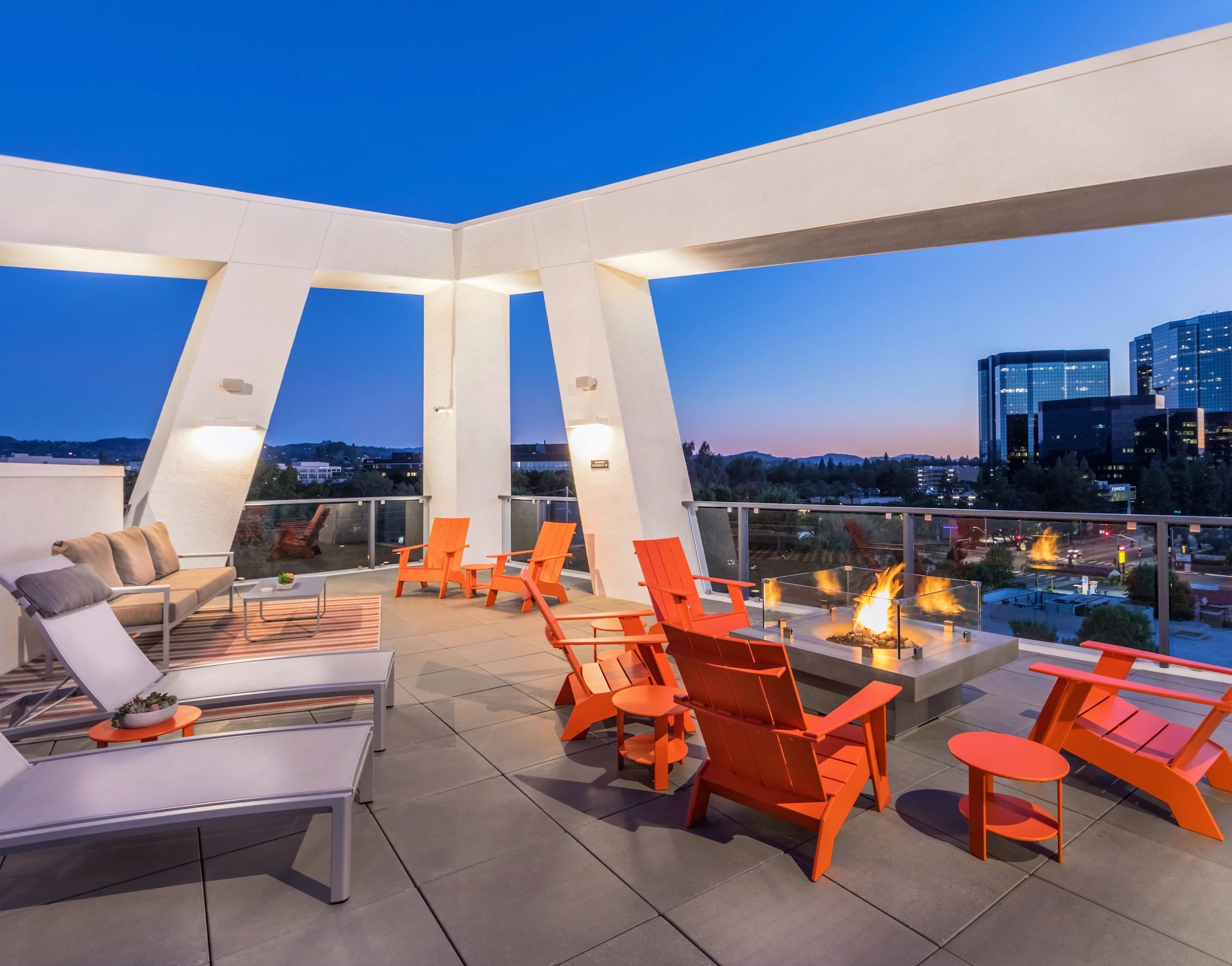 380161223317521248-10-amenity-tower-rooftop-lounge-fire-pit-night-at-vela-on-ox-apartments-in-woodl.jpg