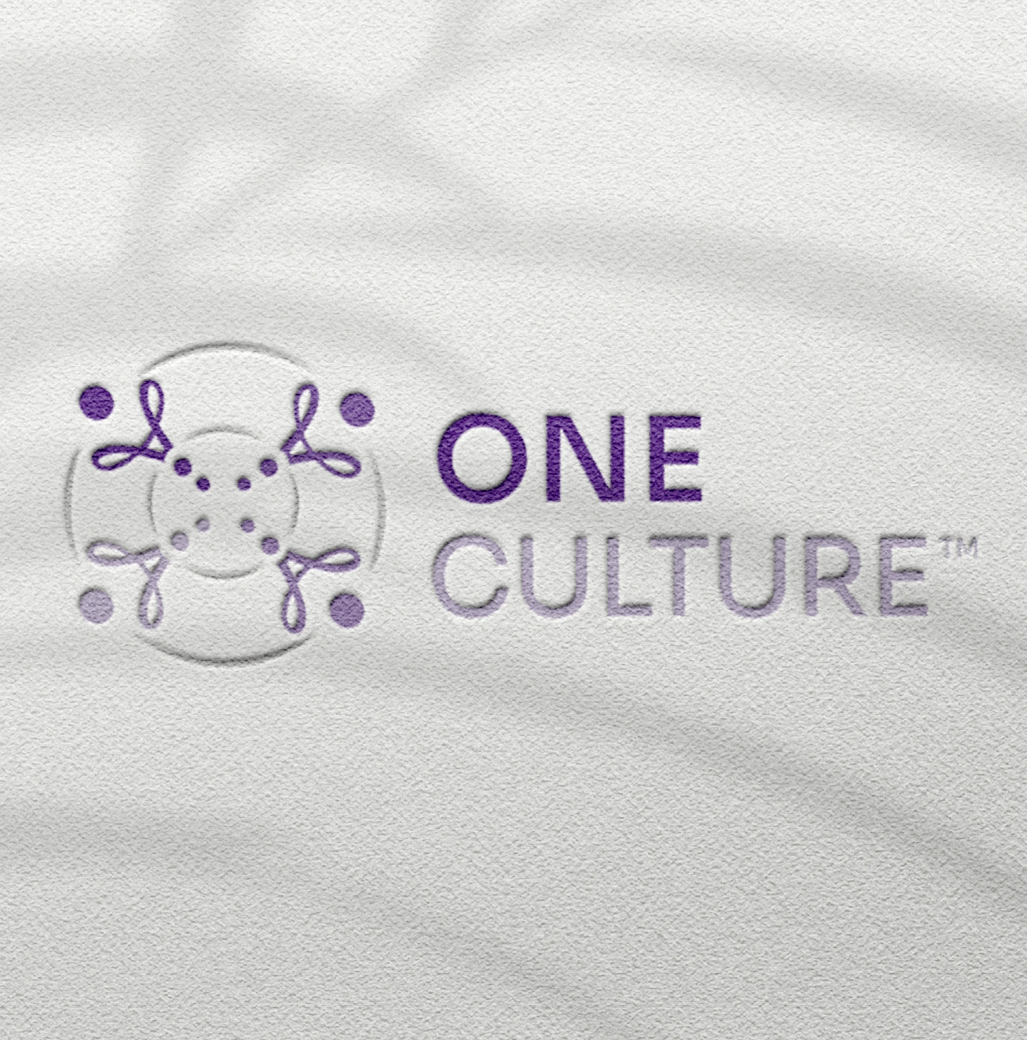 a mockup of the purple logo of One Culture logo