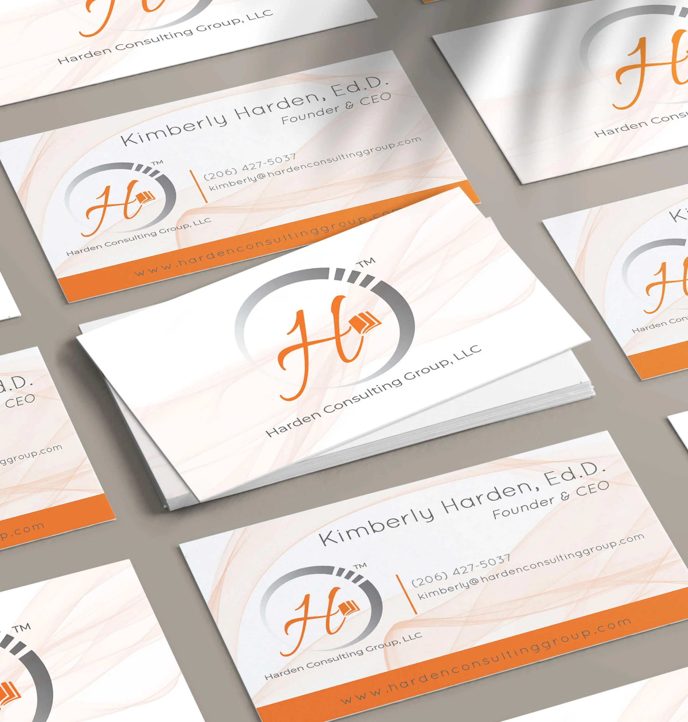 Multiple business cards displaying the H of the logo of Harden Consulting Group created by me