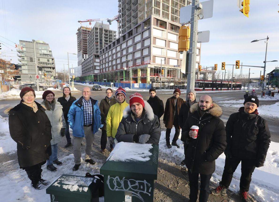 A picture of More Neighbours Toronto volunteers on a snowy winter day in the distillery district.