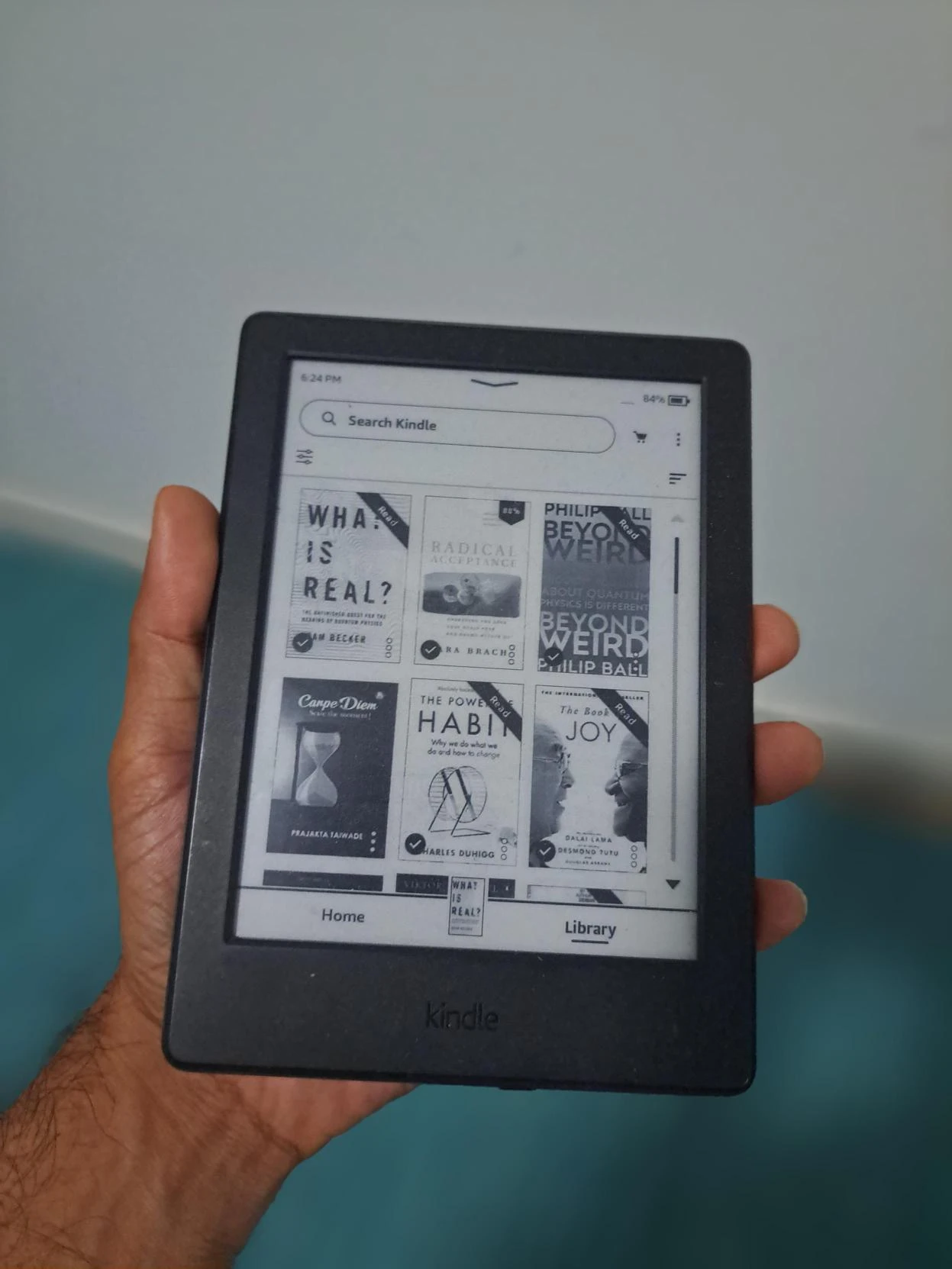 Picture of a kindle e-book reader demonstrating Aakash's liking for reading