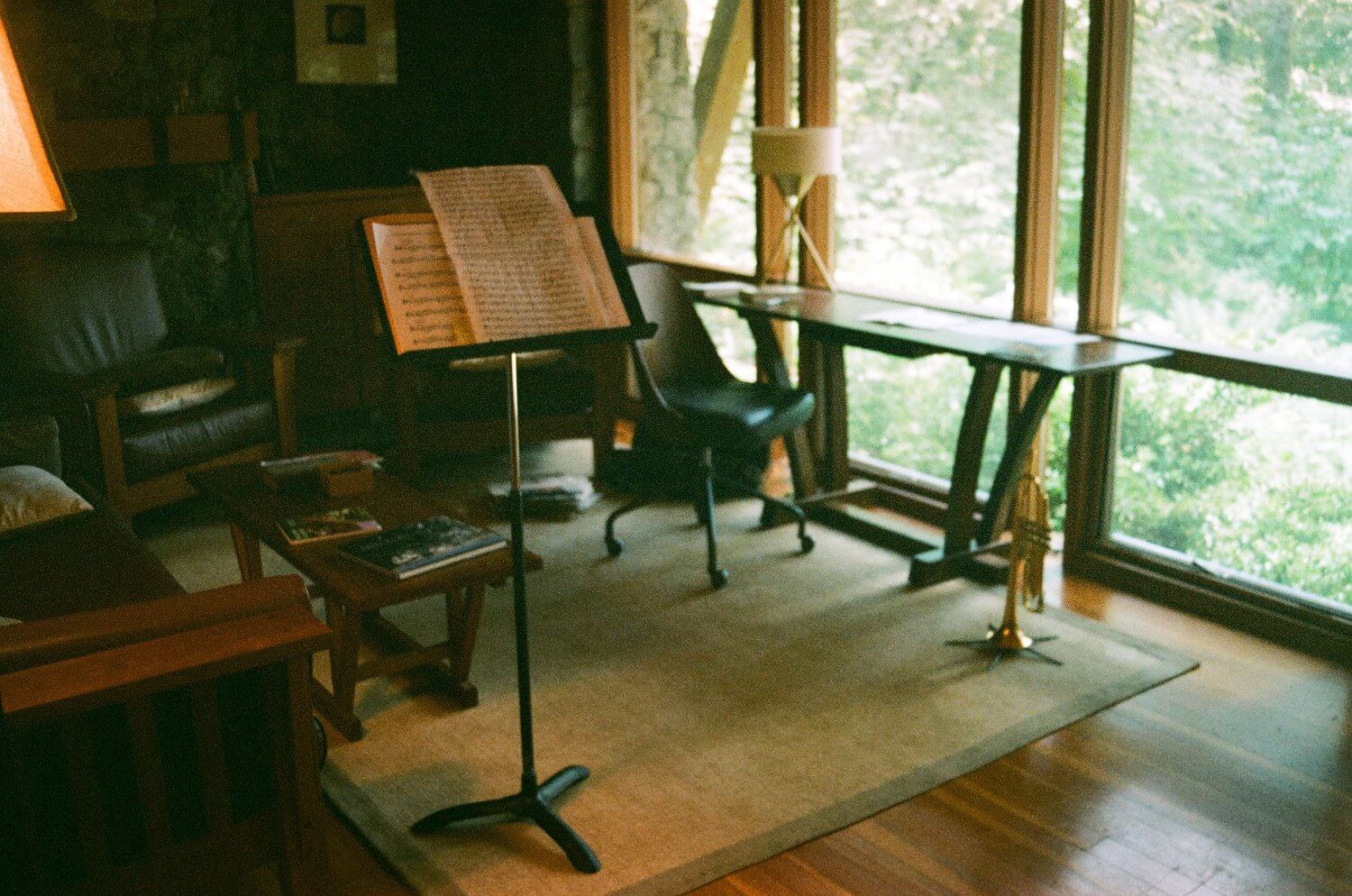 practice space and music stand and trumpet in a wood house