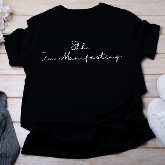 158-shh-im-manifesting-tshirt-16806228833244.png