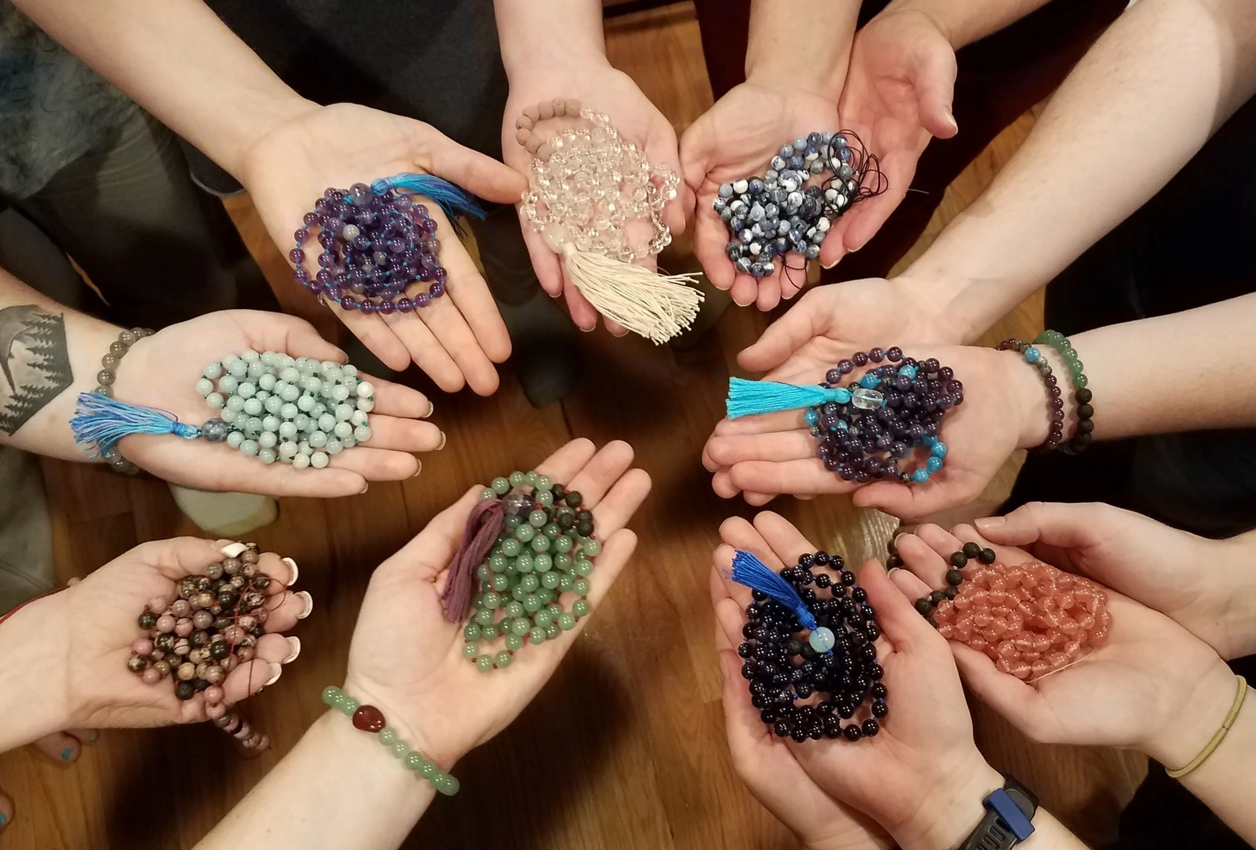 2370-guests-holding-all-the-mala-beads-17158142254996.jpg