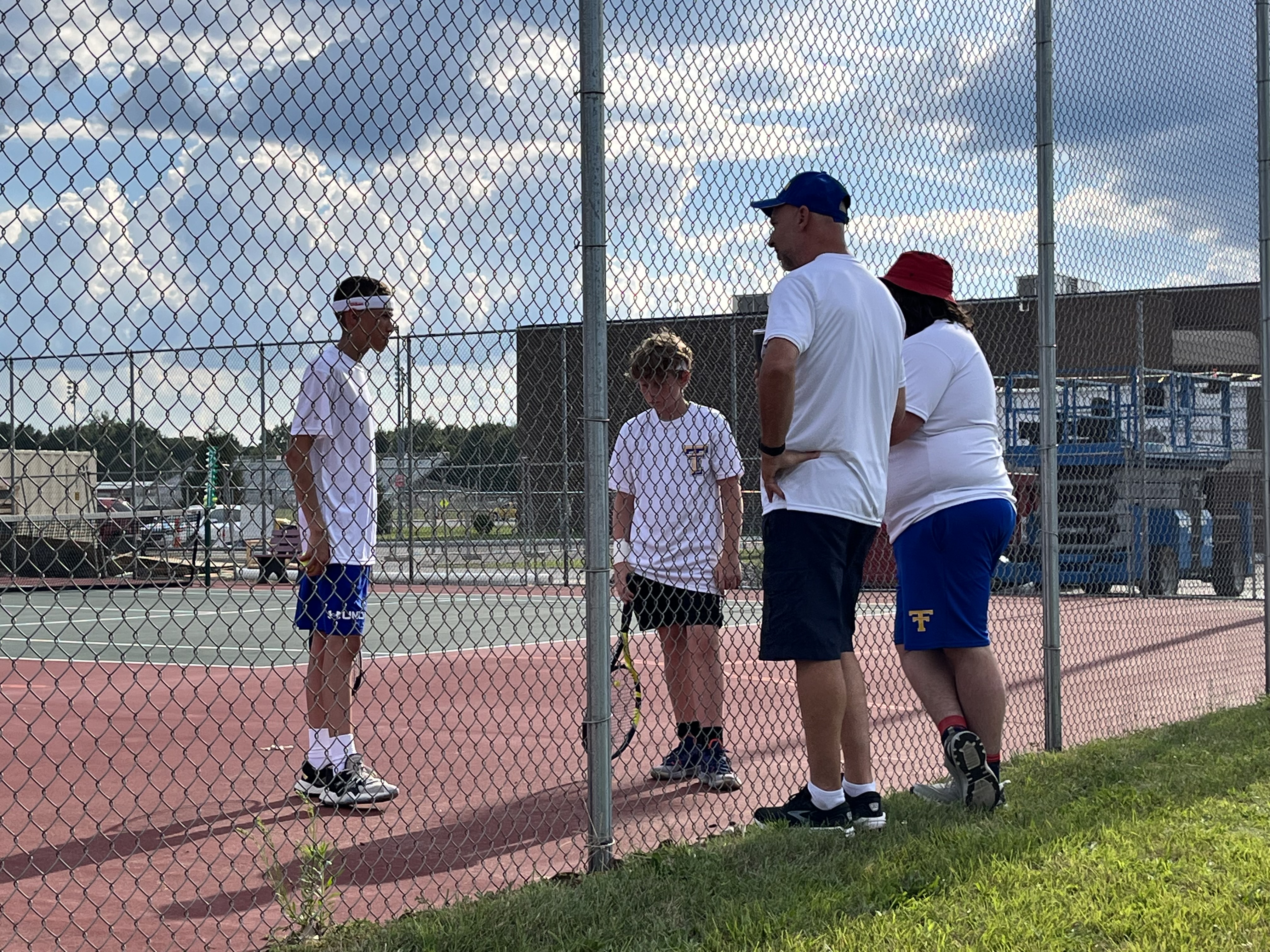 Bottom Picture #2 Doubles Ethan Shively and Isaiah Vaca talking strategy with coaches at Knox Conference match