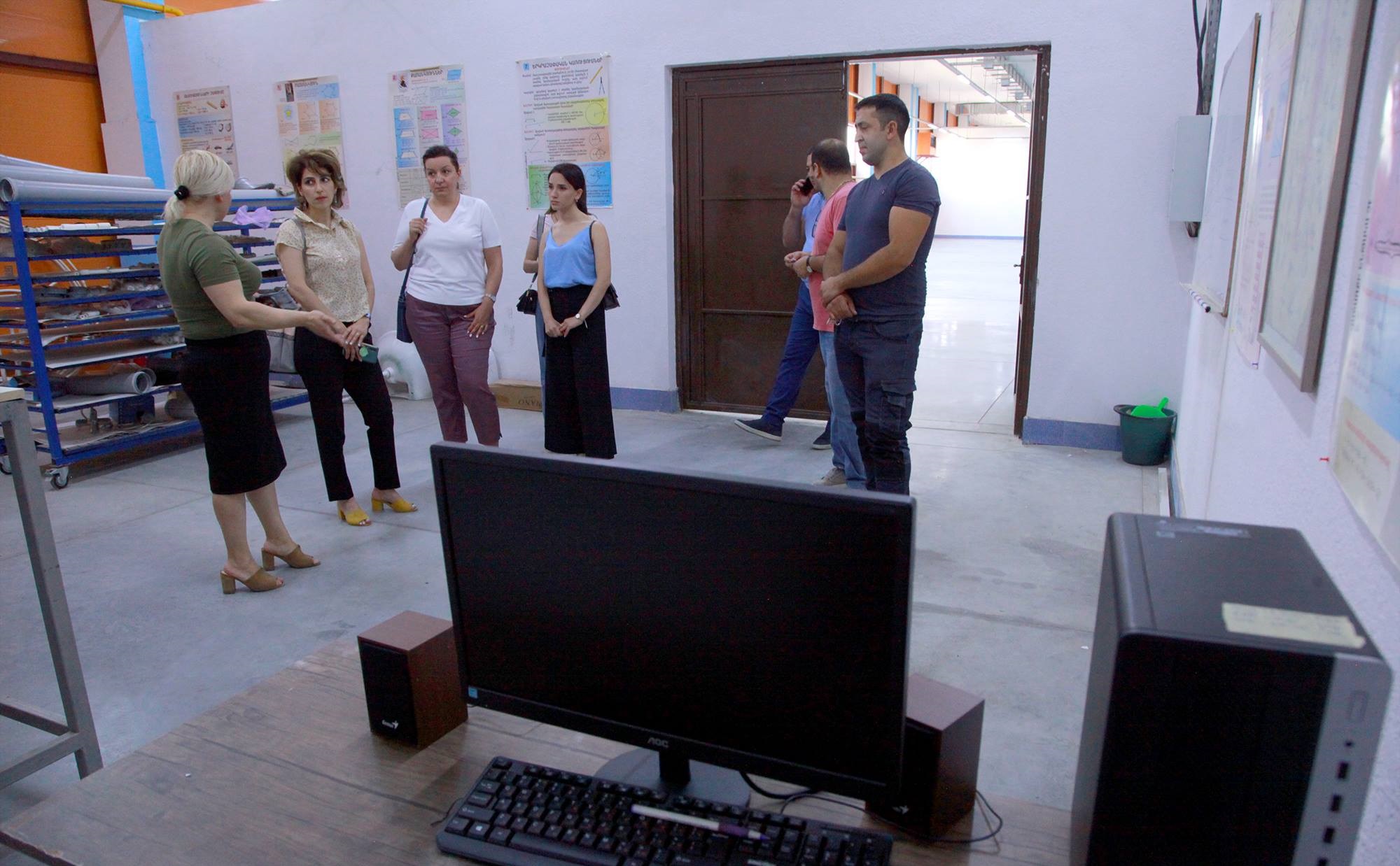1.	Members of the Tufenkian Foundation team visiting the Yeznik Mozian Vocational School on June 14 (Photo: ArtsakhPress/Tufenkian Foundation)