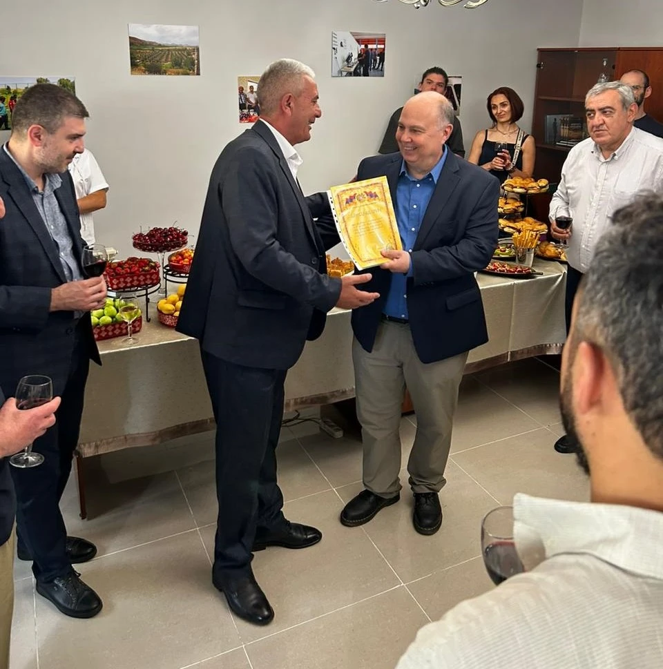 Tatev community leader handing a letter of appreciation to Tufenkian Foundation Director Greg Bedian